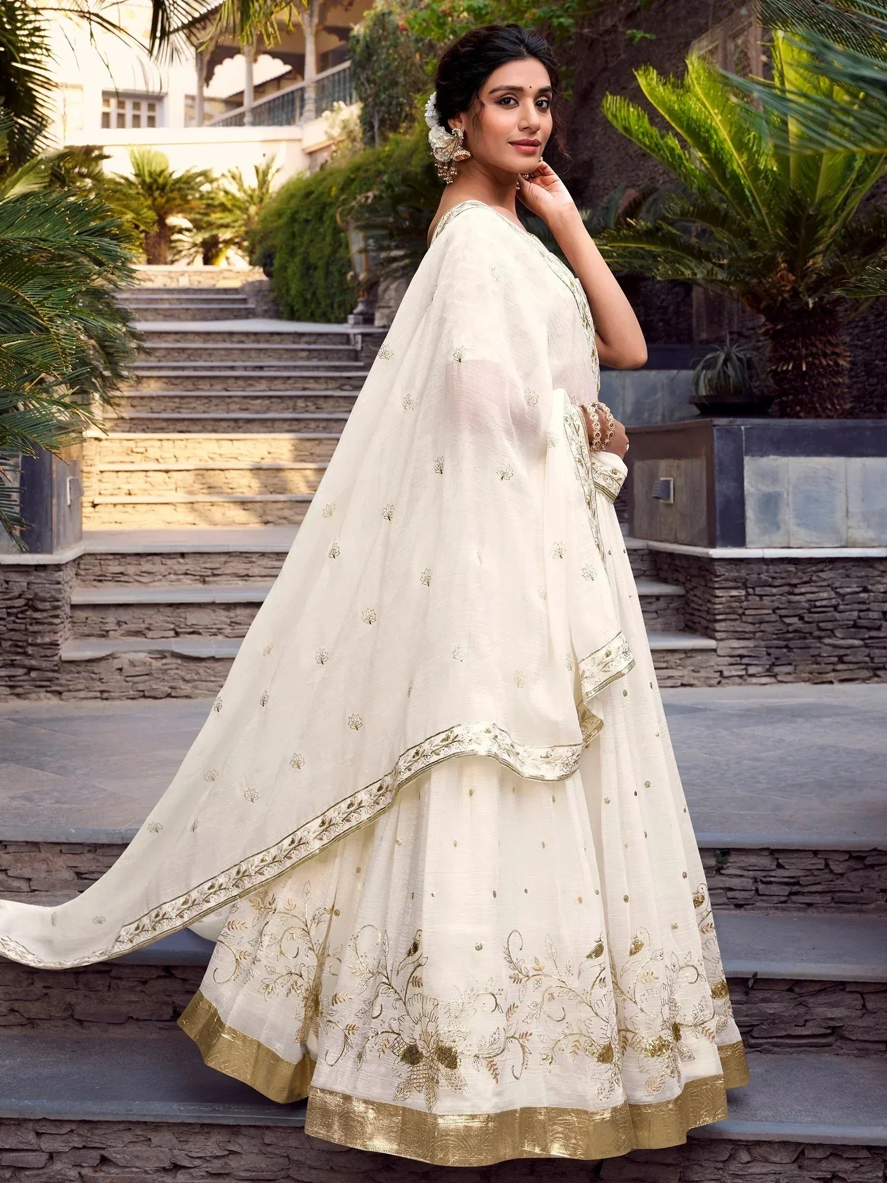 Cream embroidered lehenga choli with gold detailing, perfect for Indian ethnic wear occasions