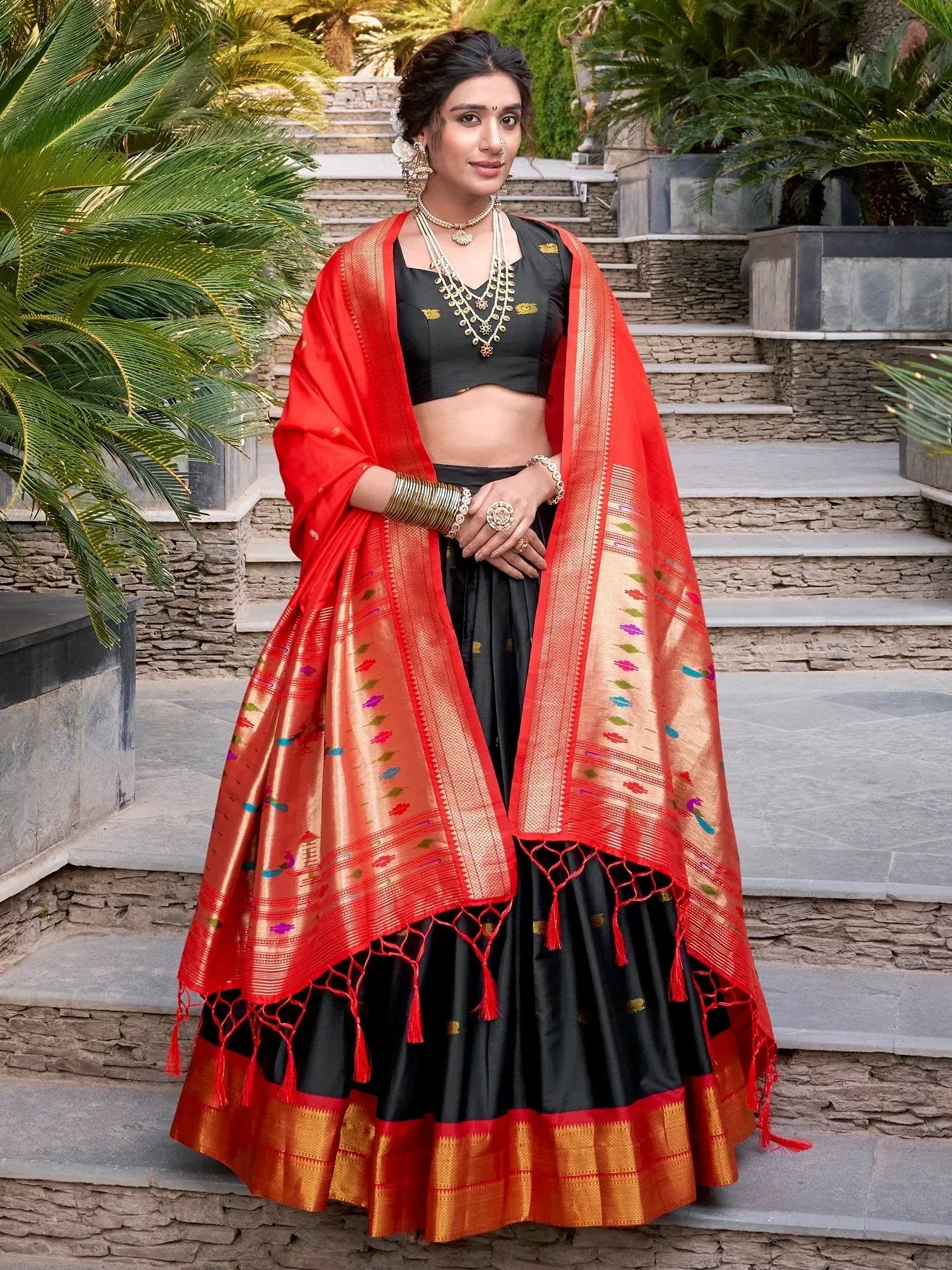 Black and red designer lehenga choli with embroidered dupatta, perfect for Indian ethnic wear occasions.
