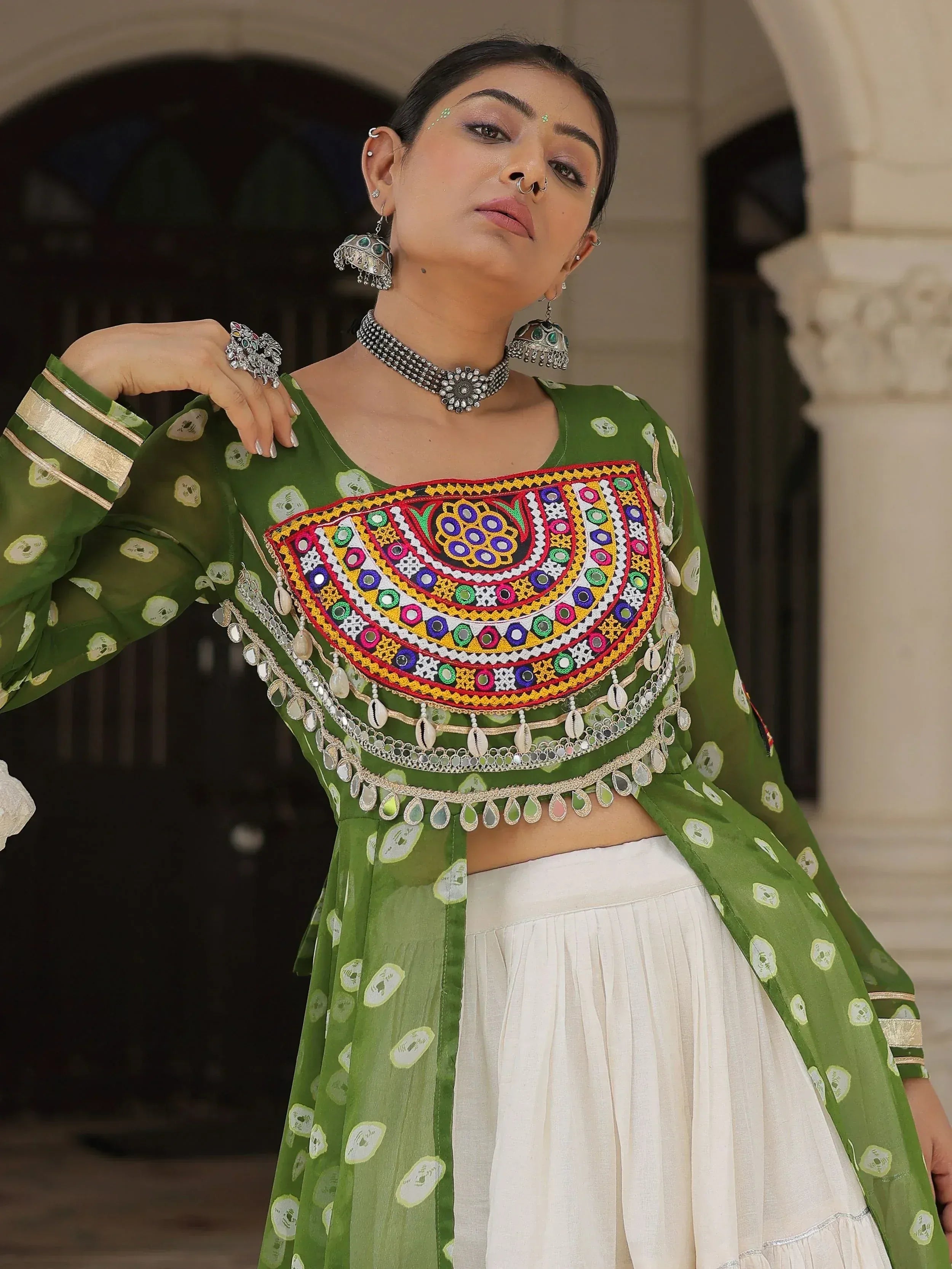 Green embroidered ethnic top with mirror work and white skirt, traditional Indian wear