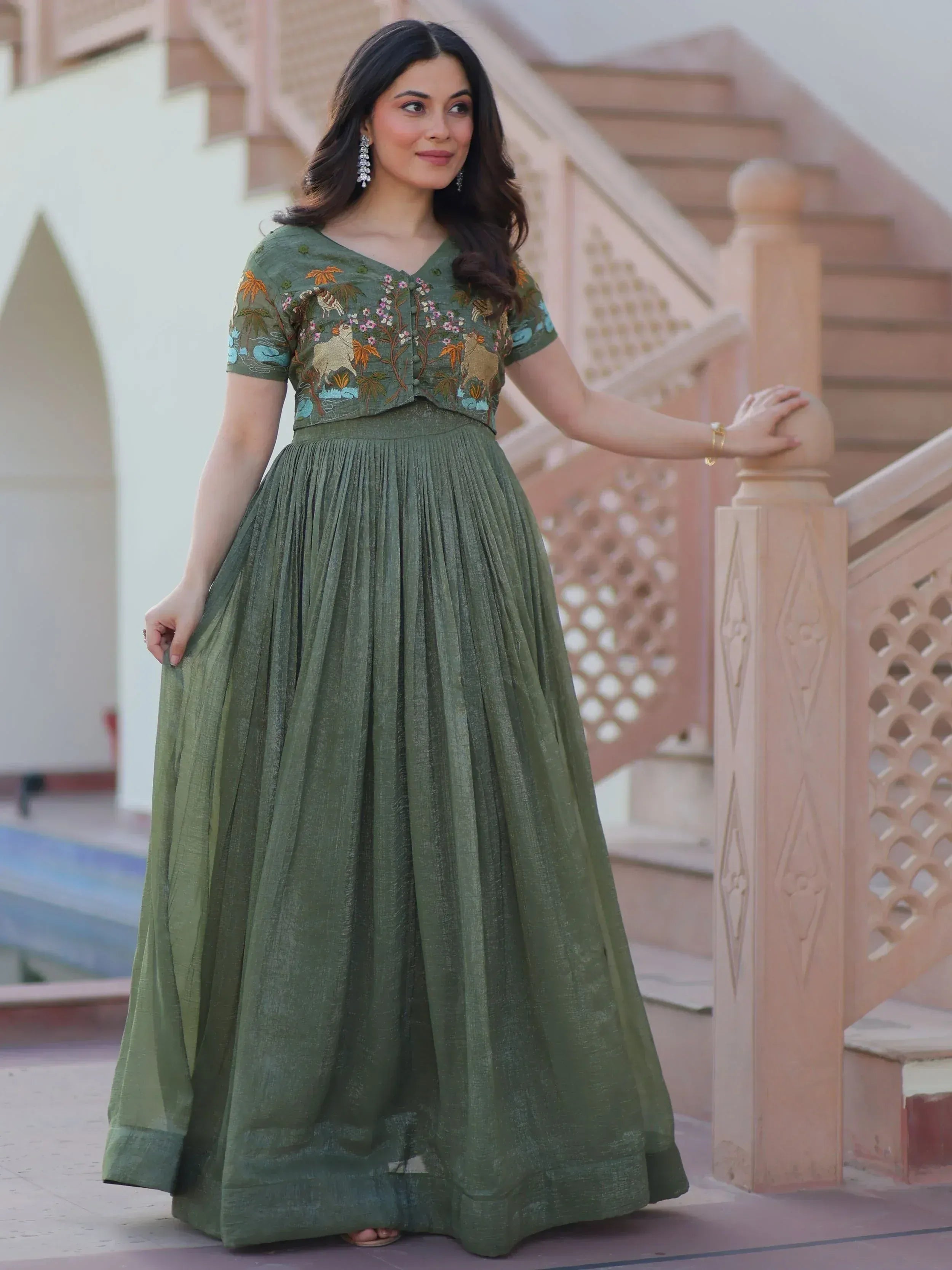 Olive green embroidered ethnic gown with floral and animal motifs, pleated skirt, perfect for Indian occasions