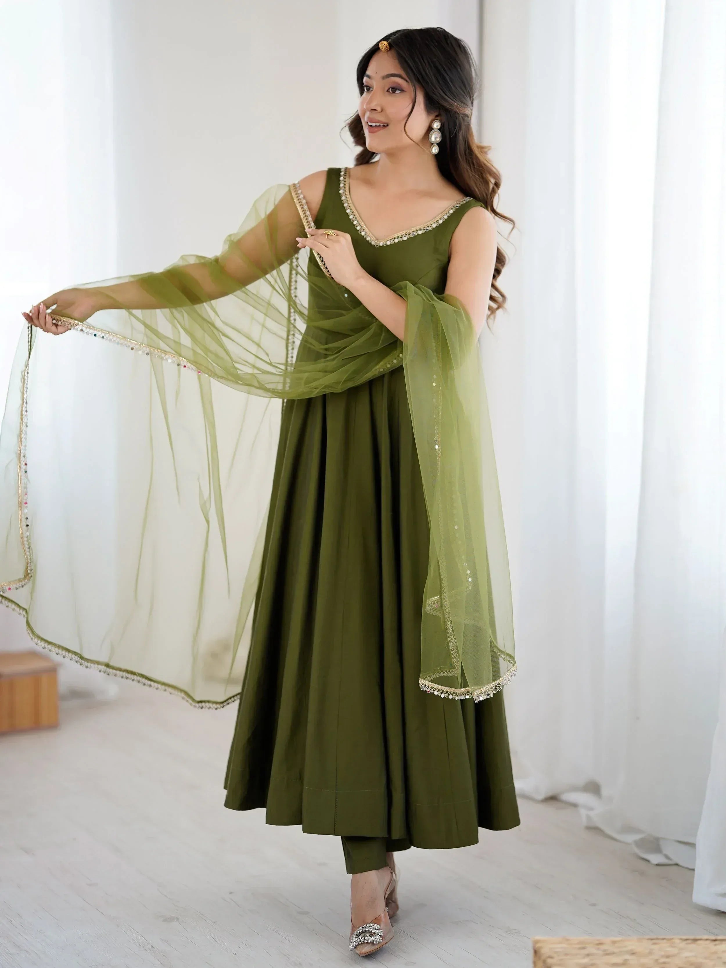 Olive green ethnic anarkali suit with sheer dupatta, perfect for Indian weddings and festive occasions