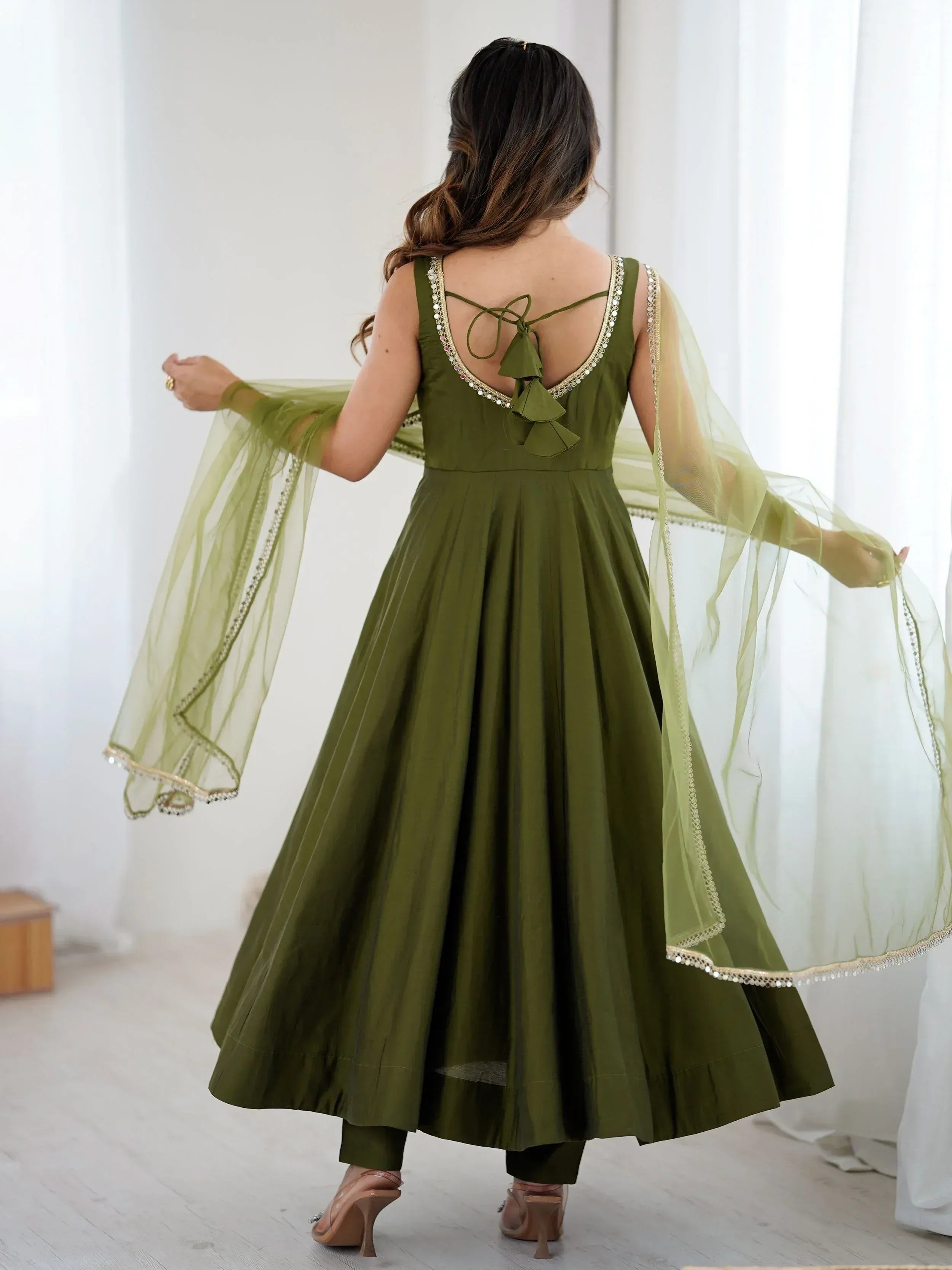 Olive green ethnic gown with back tie detail and sheer dupatta, perfect for Indian occasions