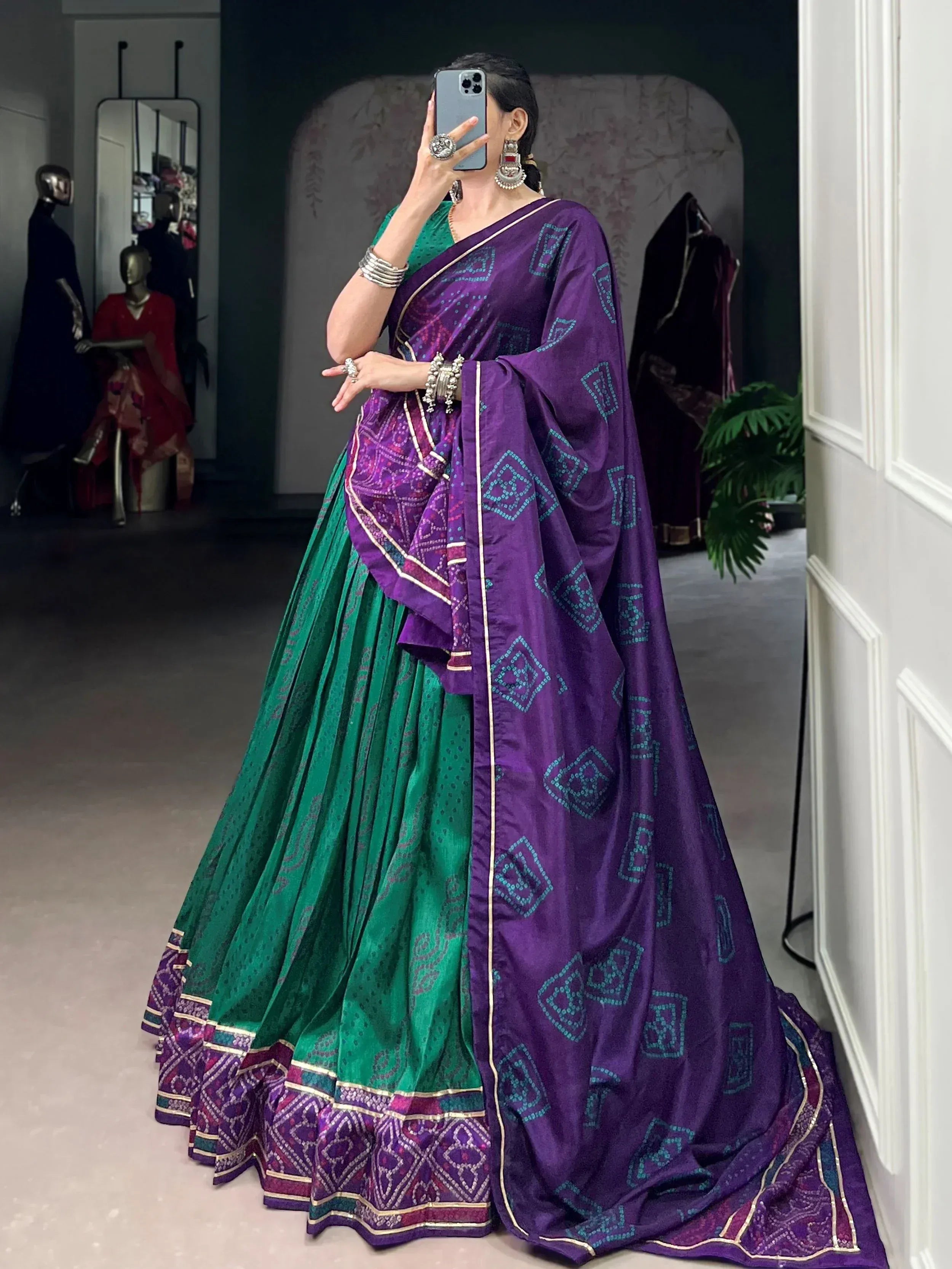 Purple and green ethnic lehenga choli with geometric print, perfect for Indian weddings and festive occasions.