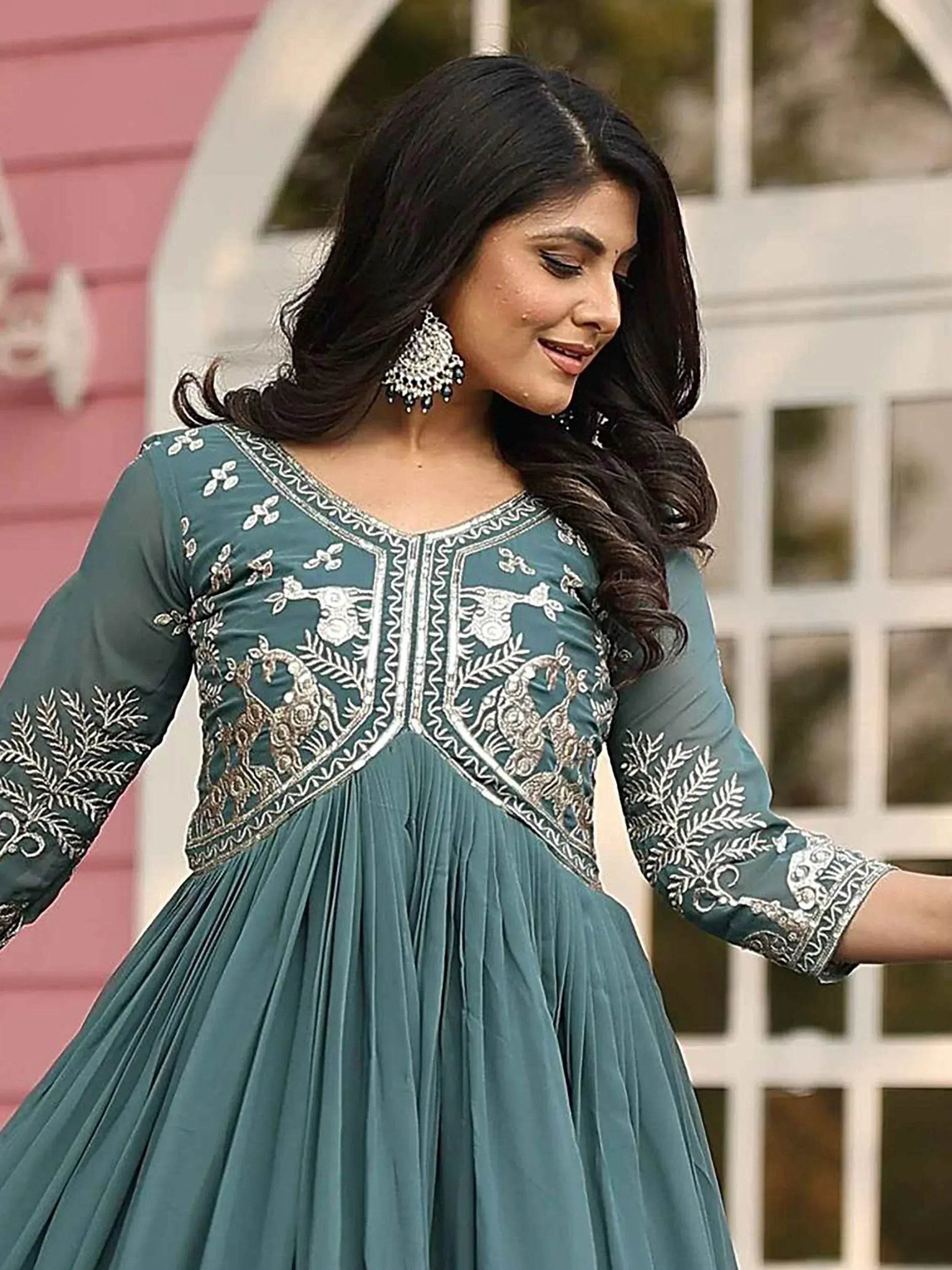 Teal embroidered ethnic gown with peacock design, perfect for Indian occasions and festive wear.
