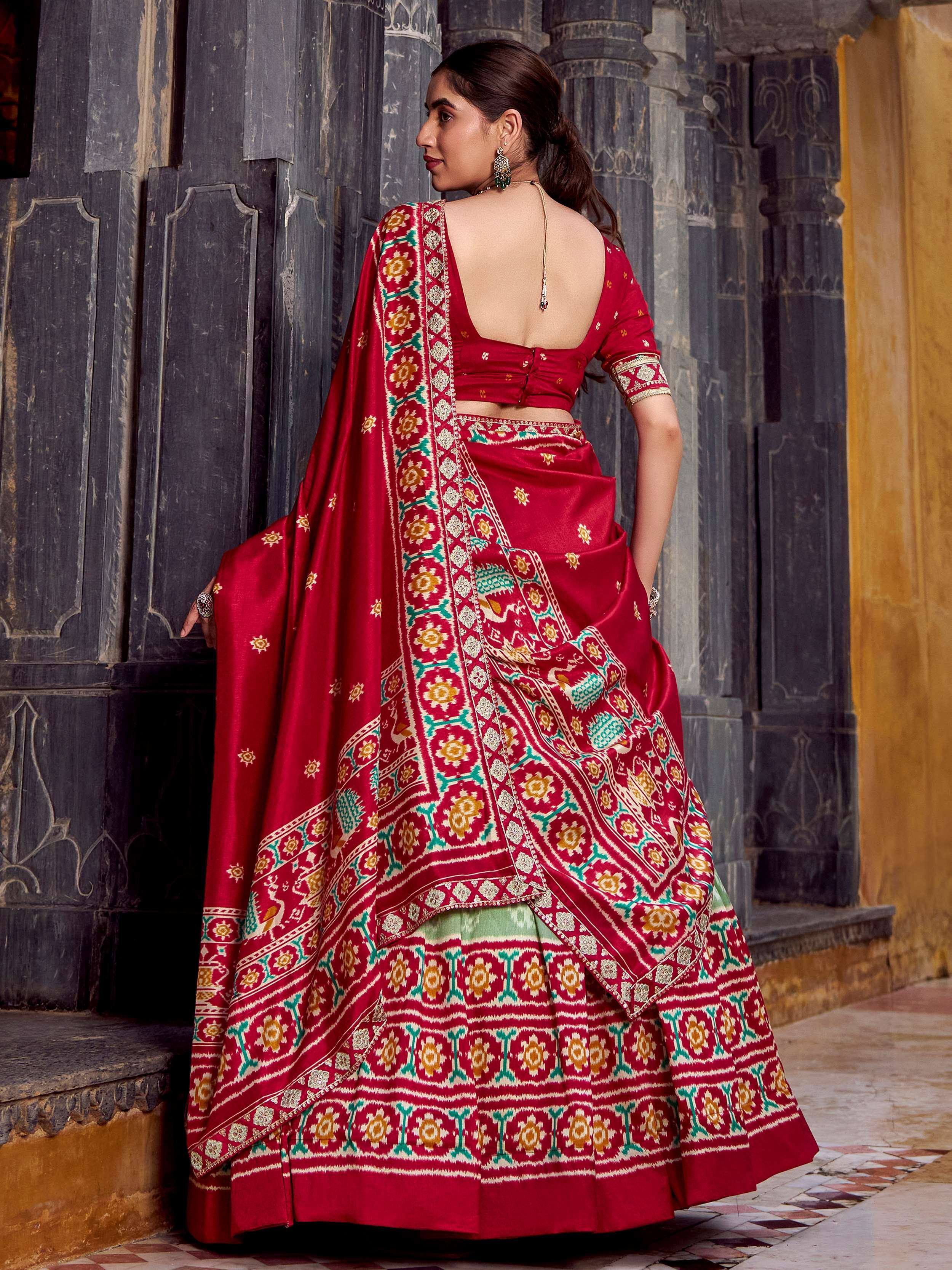 Red embroidered lehenga choli with floral patterns, perfect for Indian ethnic wear occasions