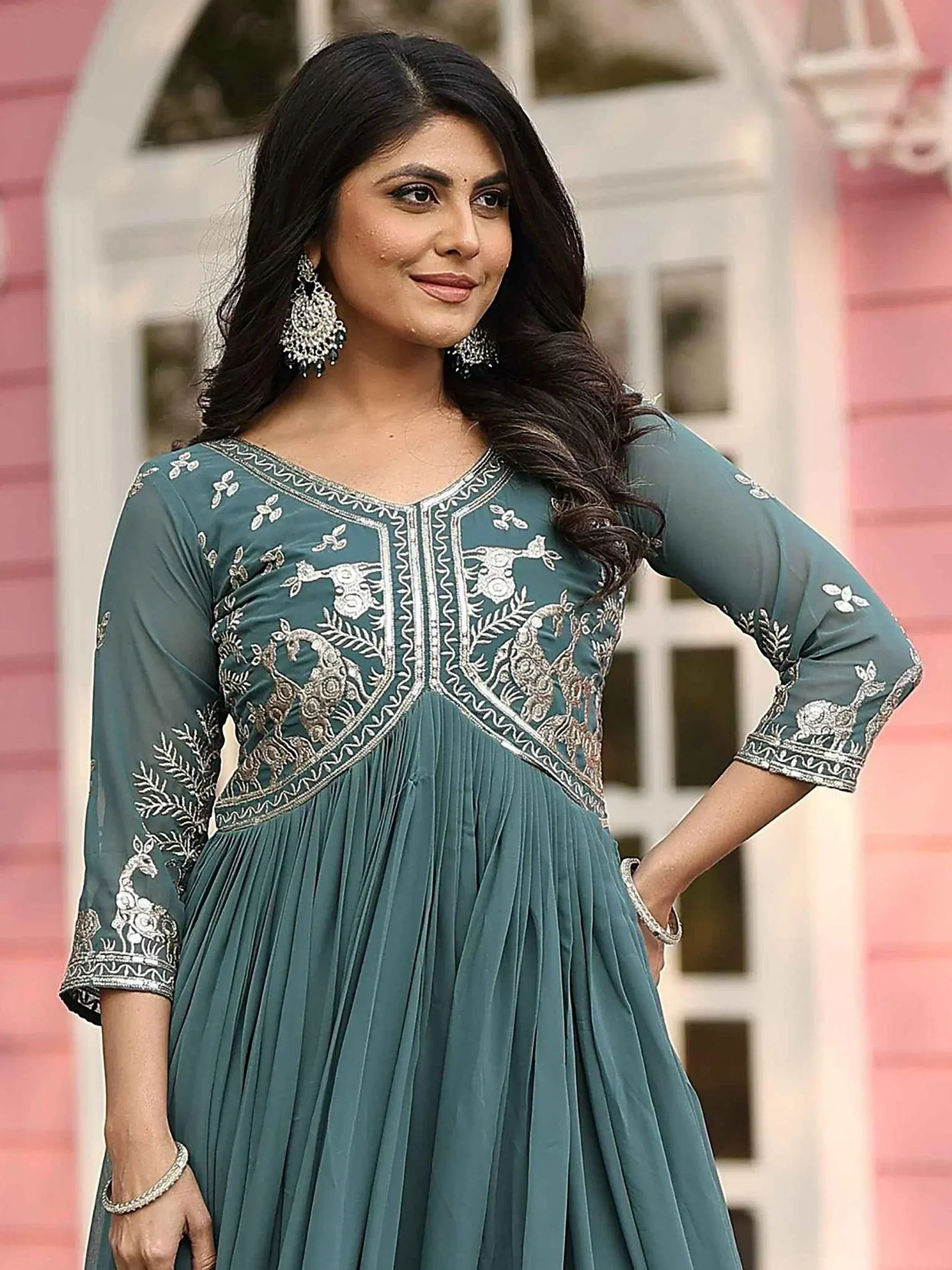 Teal ethnic gown with peacock embroidery, perfect for Indian occasions and festive wear.