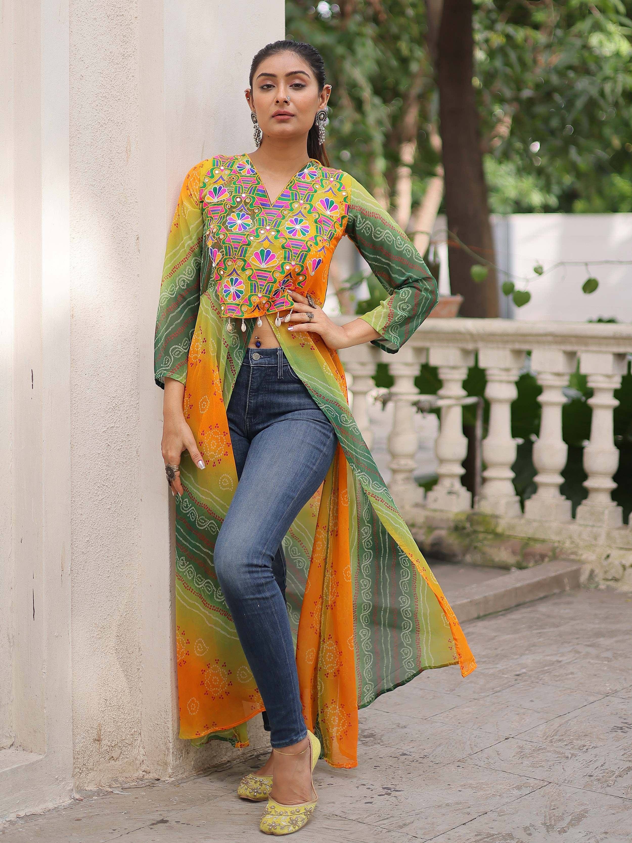 Colorful embroidered ethnic kurti with ombre dupatta, paired with jeans and juttis for a fusion look