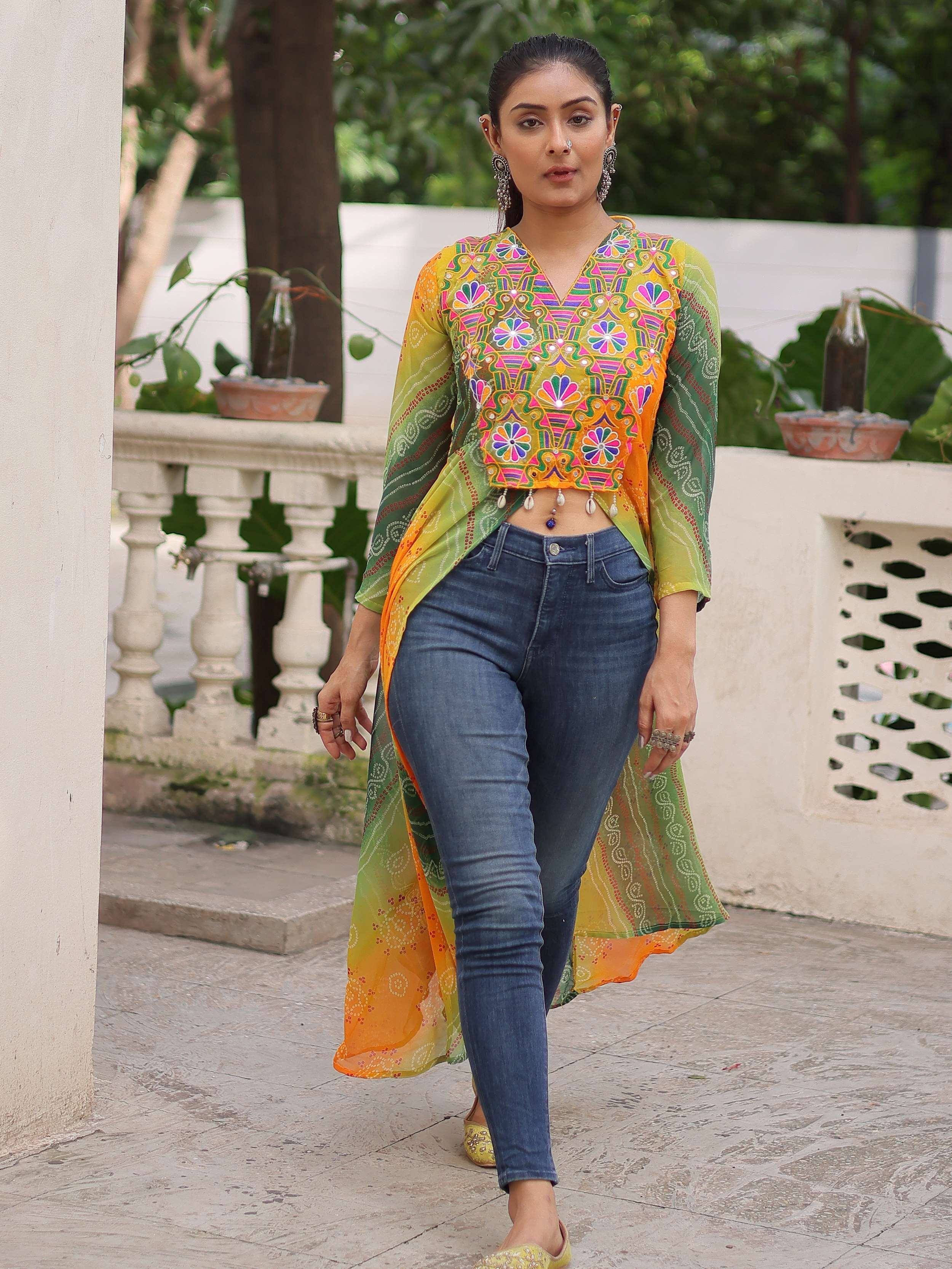 Colorful embroidered ethnic crop top with sheer ombre dupatta, paired with jeans for fusion wear
