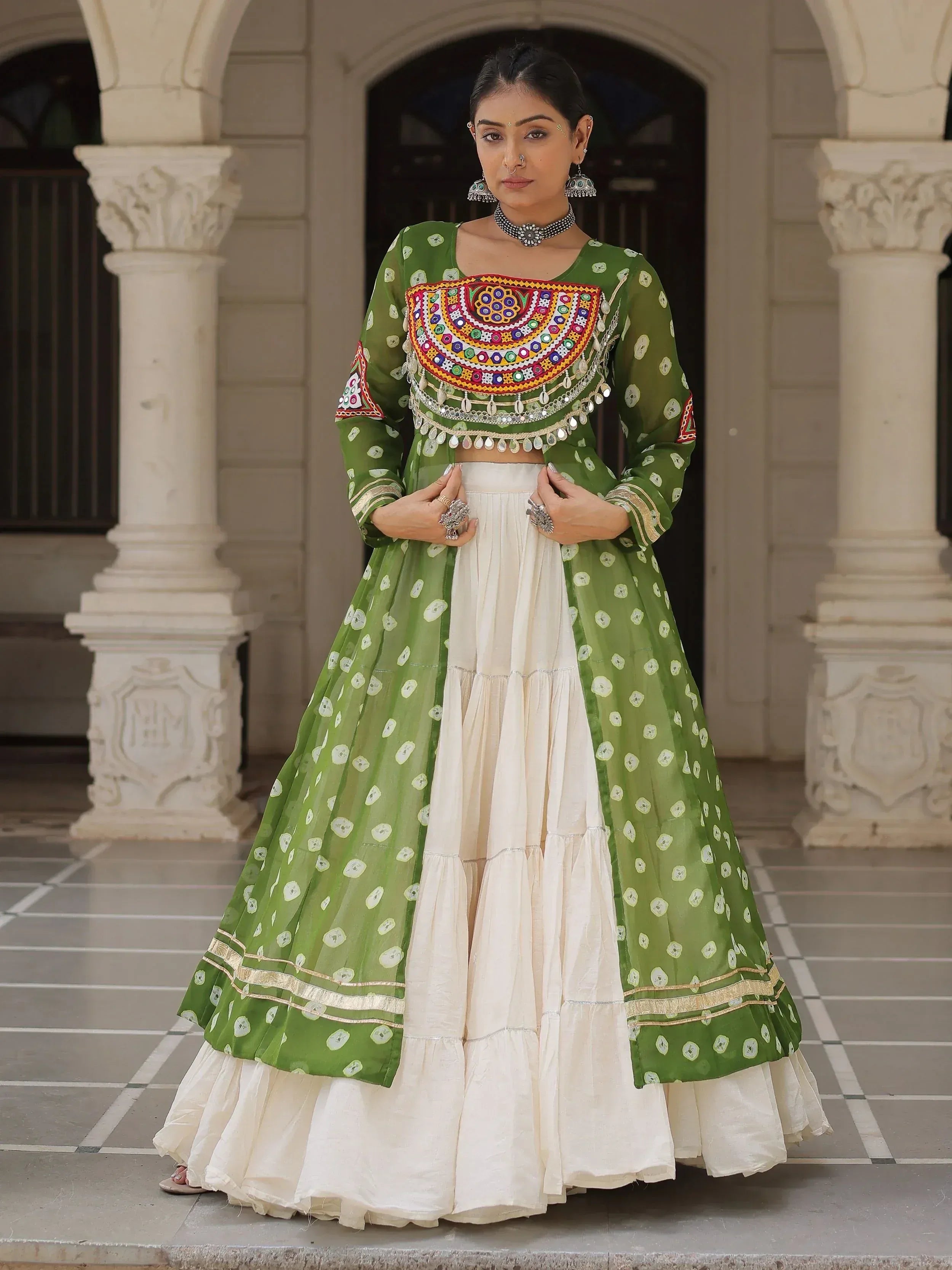 Green and ivory embroidered lehenga choli with mirror work, perfect for Indian ethnic wear occasions