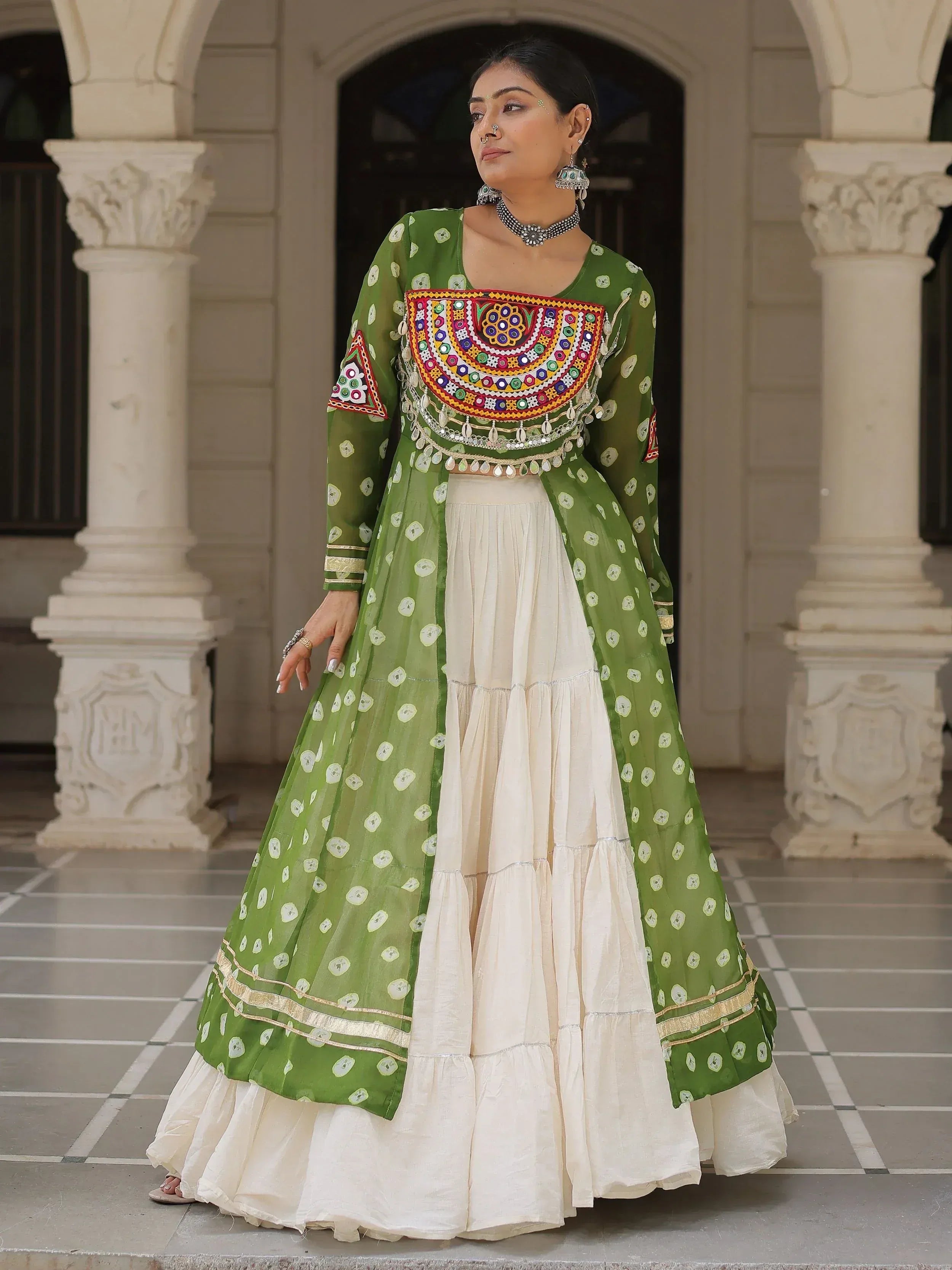 Green and cream Indian ethnic wear with mirror work, perfect for festive occasions and traditional events.