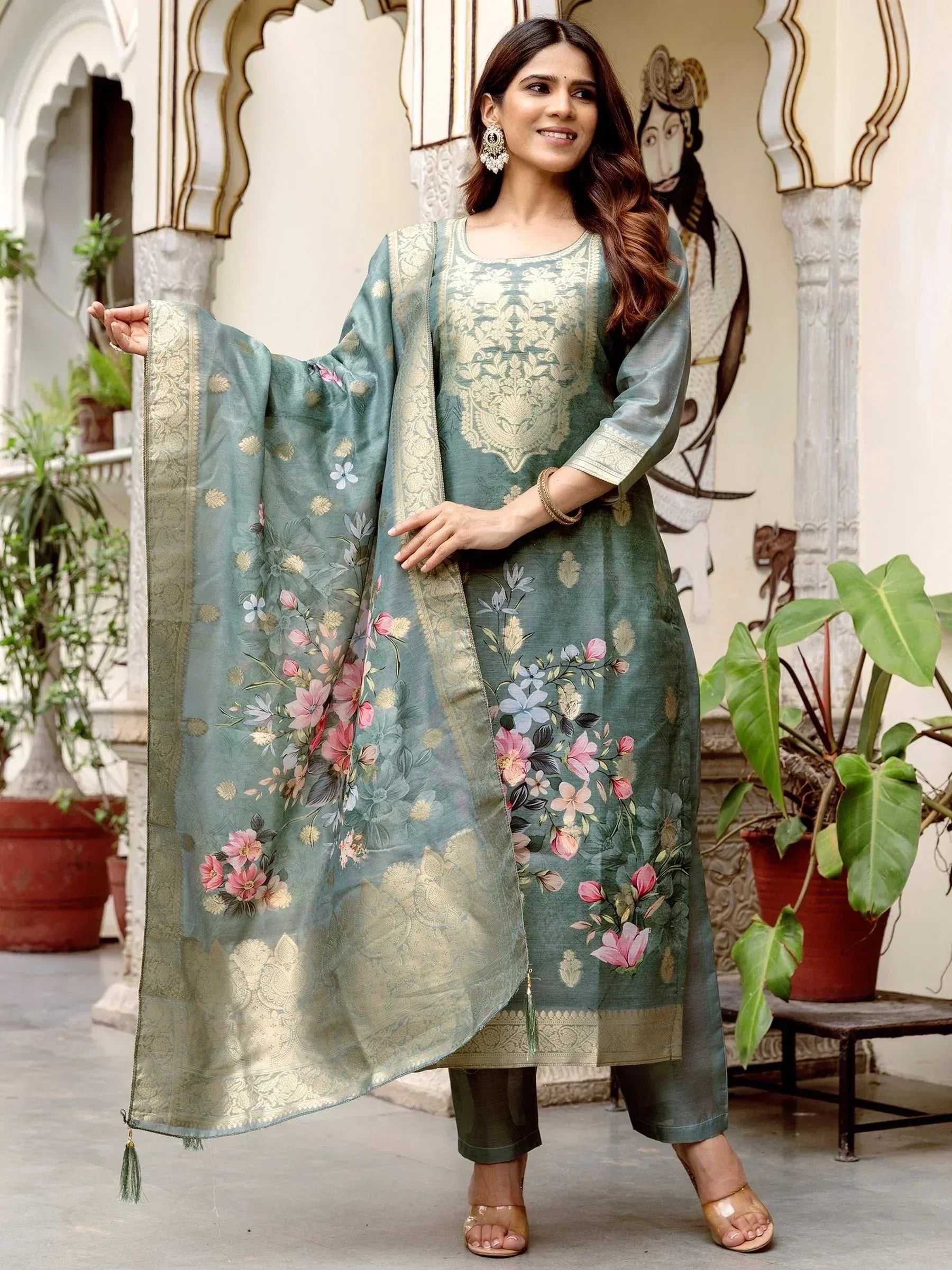 Elegant green floral printed salwar kameez with gold embroidery, perfect for ethnic occasions