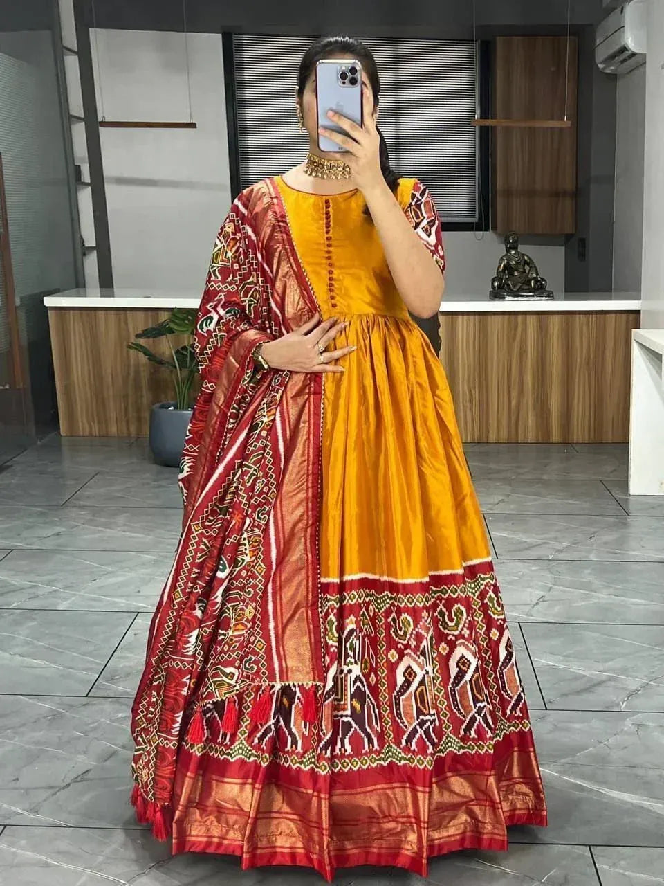 Yellow and red ethnic lehenga choli with intricate embroidery, perfect for Indian weddings and festivals