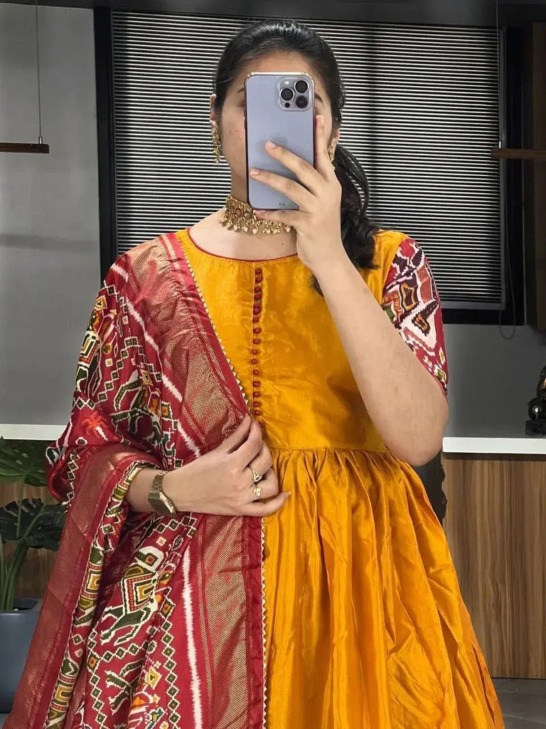 Stunning Mustard Yellow Patola Printed Dola Silk Haldi Wear Gown