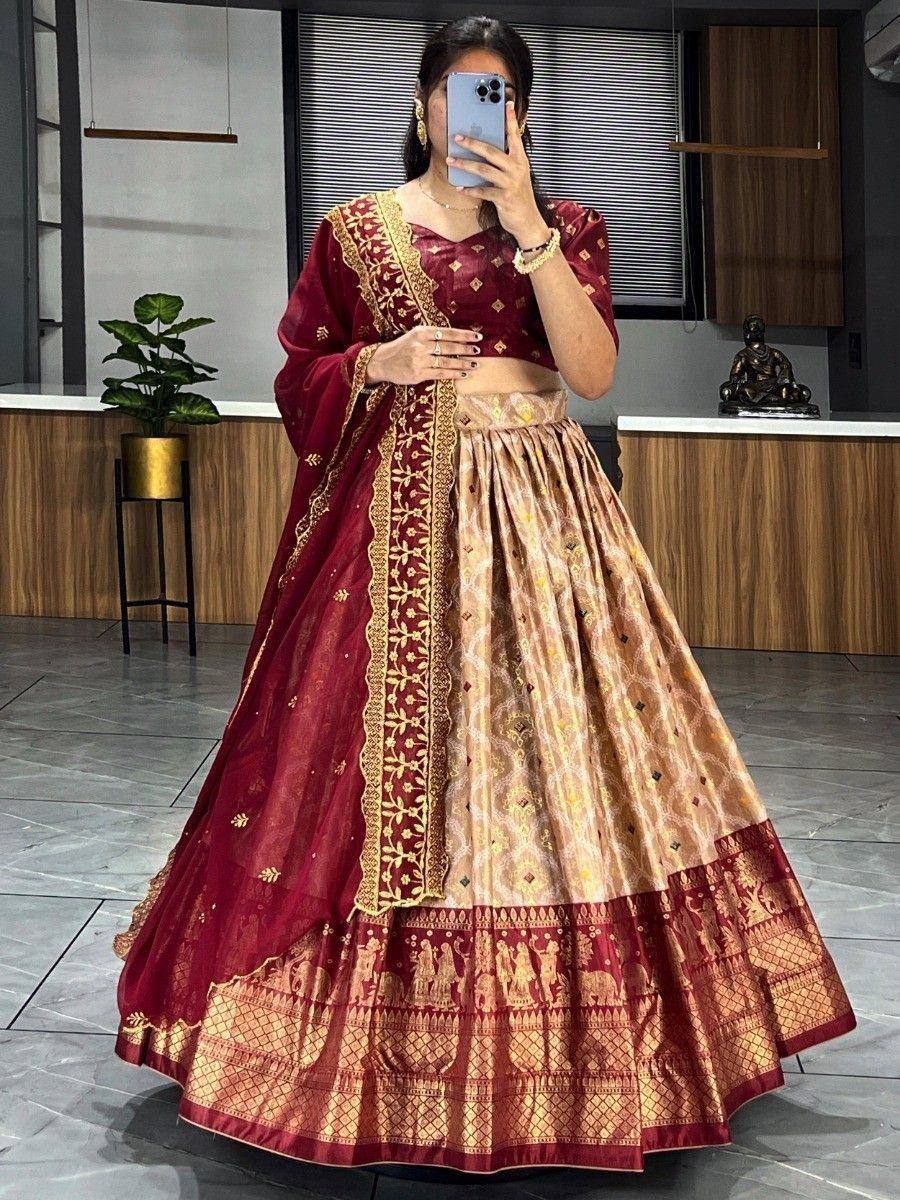 Maroon and gold designer lehenga choli with intricate embroidery and traditional motifs, perfect for Indian ethnic wear.