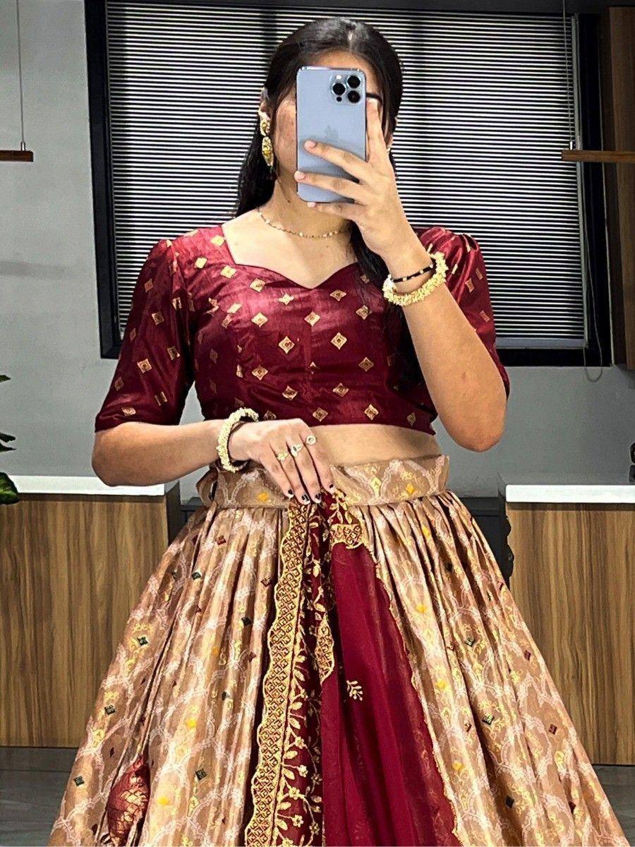 Maroon and gold designer lehenga choli with embroidered blouse and pleated skirt, perfect for Indian ethnic wear