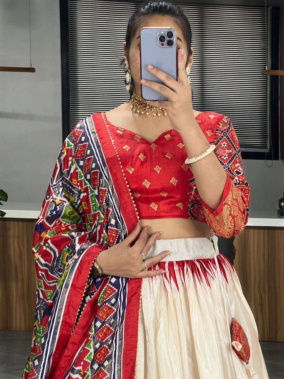 Red embroidered lehenga choli with colorful dupatta, traditional Indian ethnic wear for women