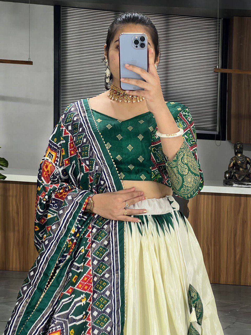 Green printed lehenga choli with ethnic motifs, perfect for festive occasions and traditional events.