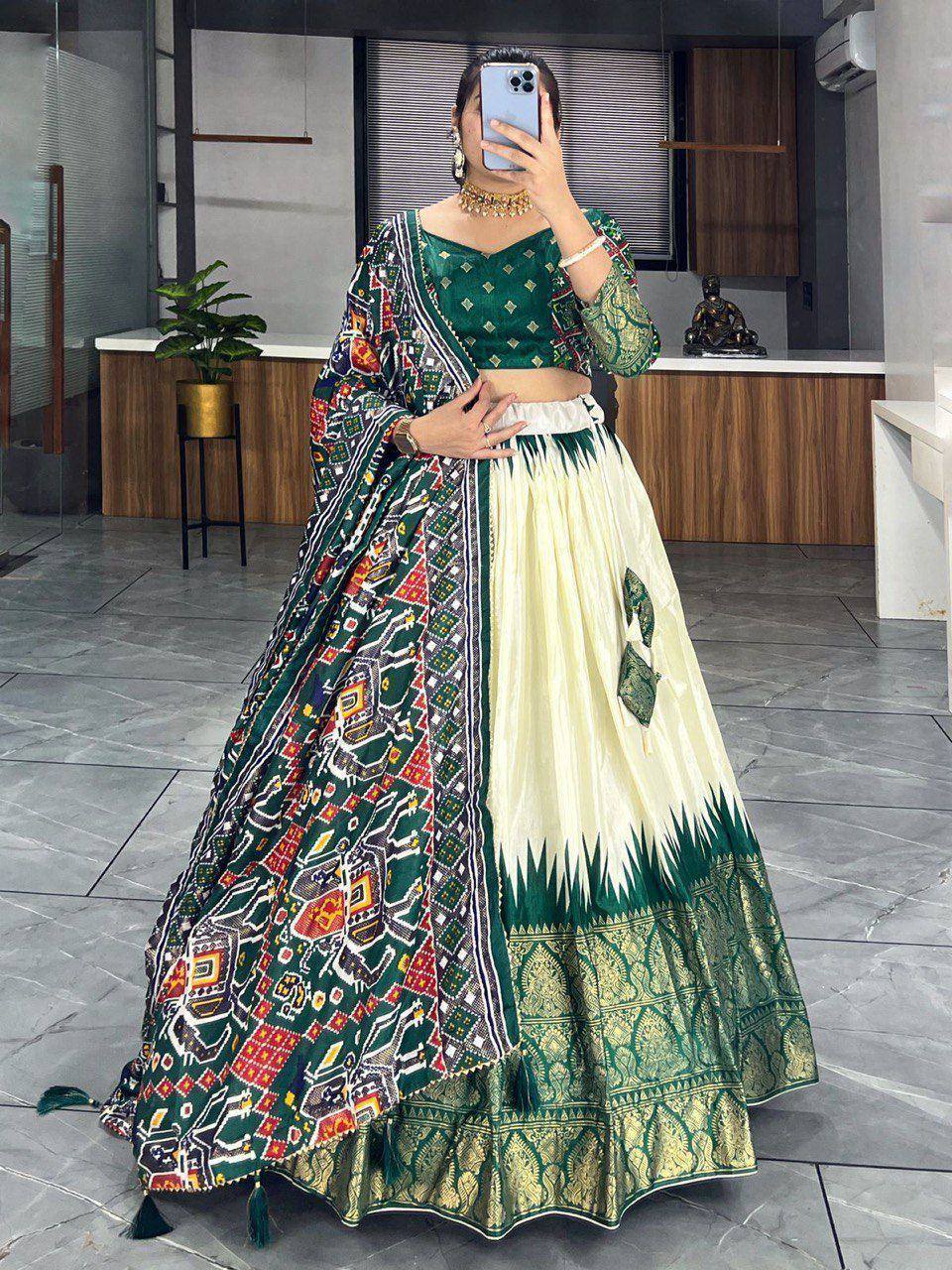 Green and cream printed lehenga choli with ethnic motifs, perfect for Indian weddings or festive occasions.