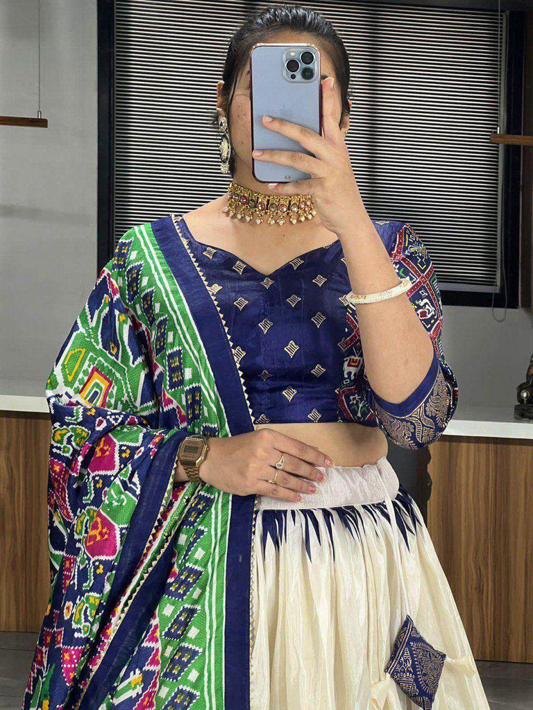 Stunning Off-White & Navy Blue Patola Printed Dola Silk Lehenga Choli