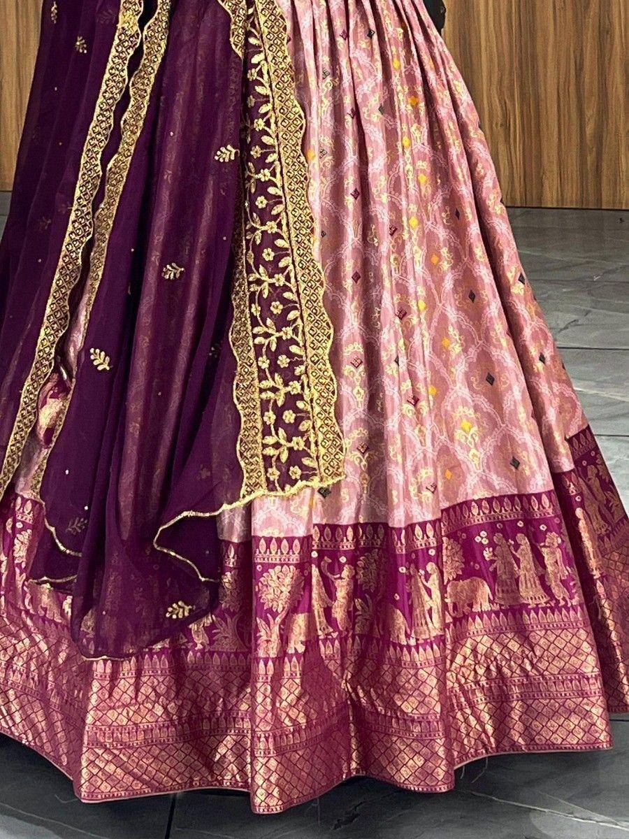Pink and purple designer lehenga with gold embroidery and traditional motifs, perfect for ethnic occasions