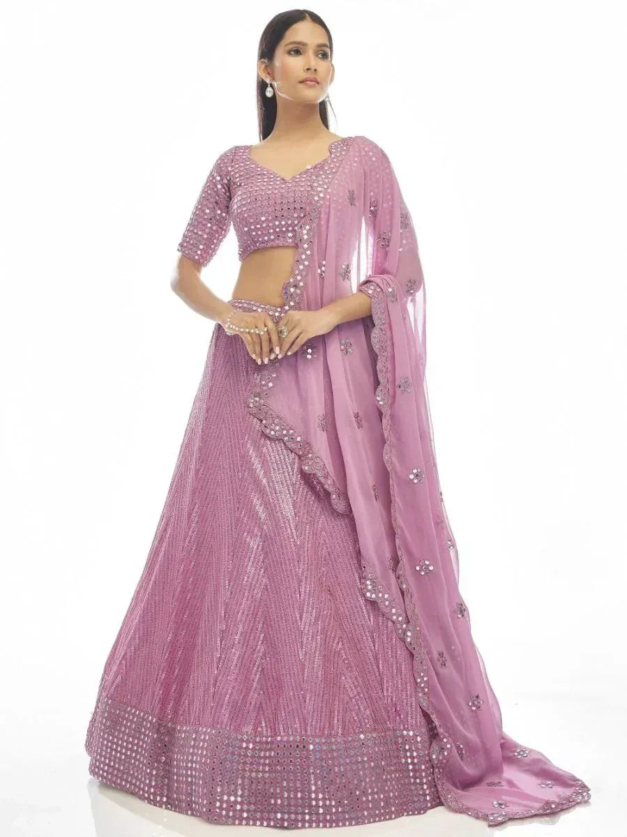 Elegant lavender lehenga choli with mirror work and sheer dupatta, perfect for Indian ethnic occasions