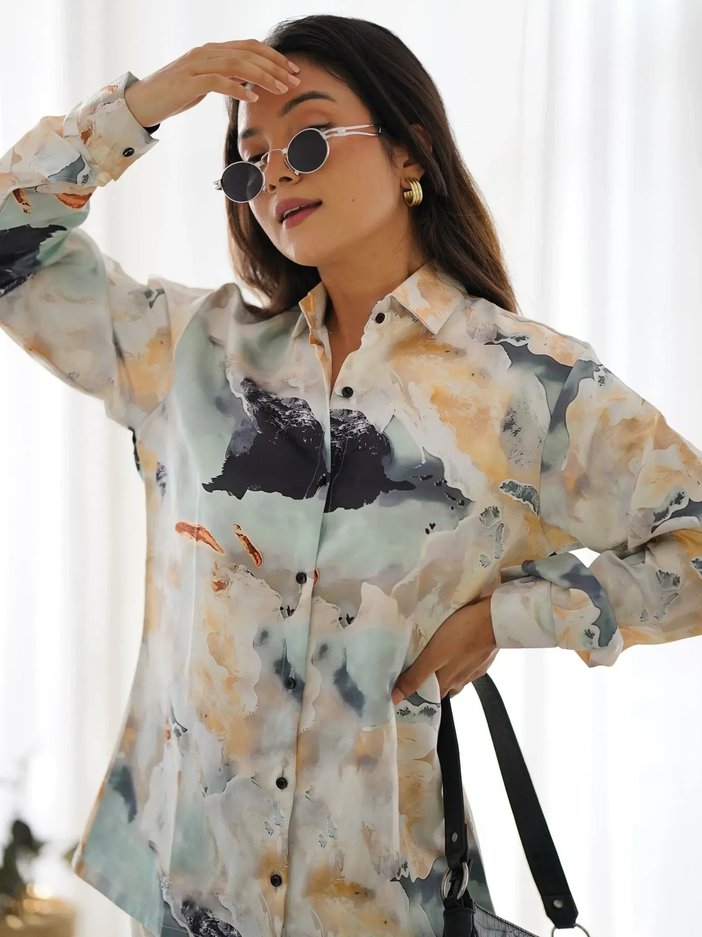 Woman in abstract print shirt with sunglasses, stylish ethnic wear outfit