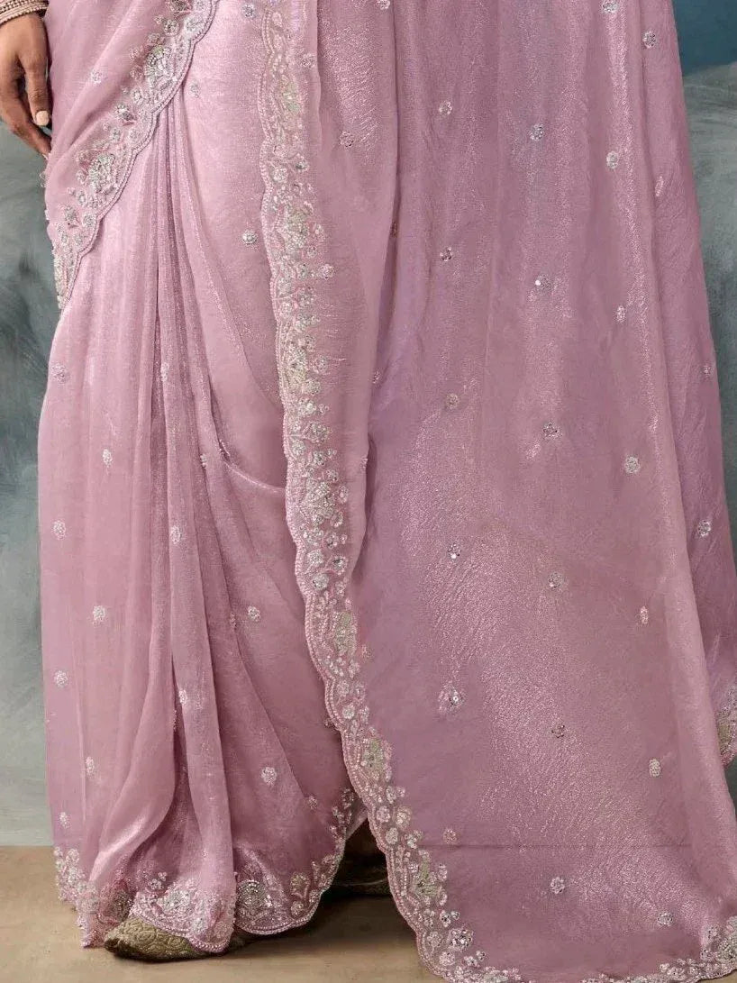 Pink embroidered saree with delicate floral lace border, perfect for ethnic occasions