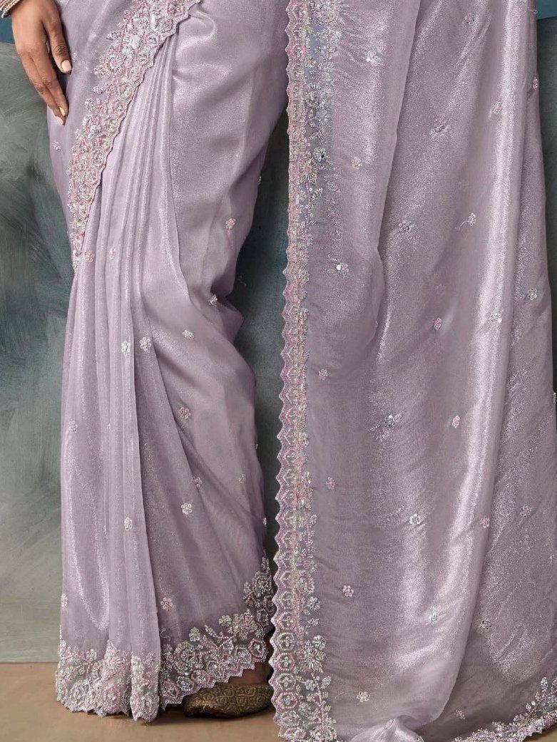 Lavender saree with intricate floral embroidery and lace border, elegant ethnic wear for women