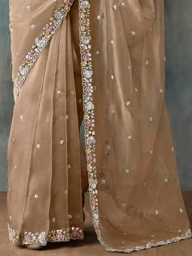 Elegant beige saree with floral embroidery and sequin detailing, perfect for Indian ethnic wear occasions.