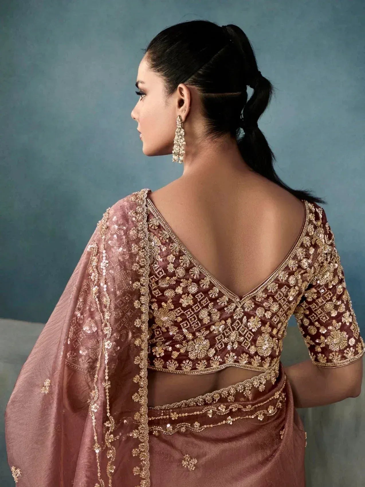 Elegant maroon saree with gold embroidery, backless blouse, and matching dupatta for Indian ethnic wear