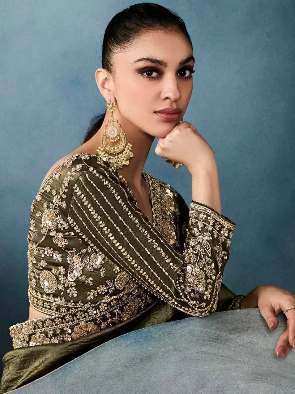 Olive green embroidered designer salwar kameez with gold detailing and statement earrings