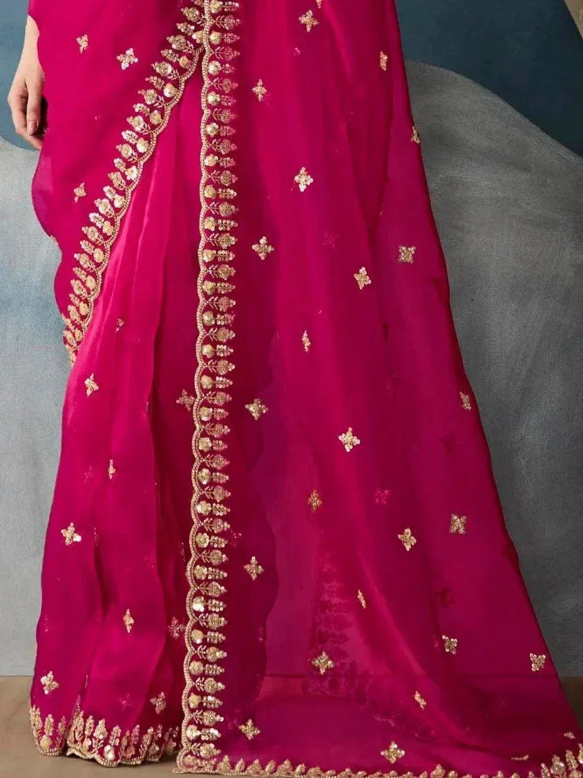 Fuchsia pink designer saree with gold floral embroidery and scalloped border, ethnic wear