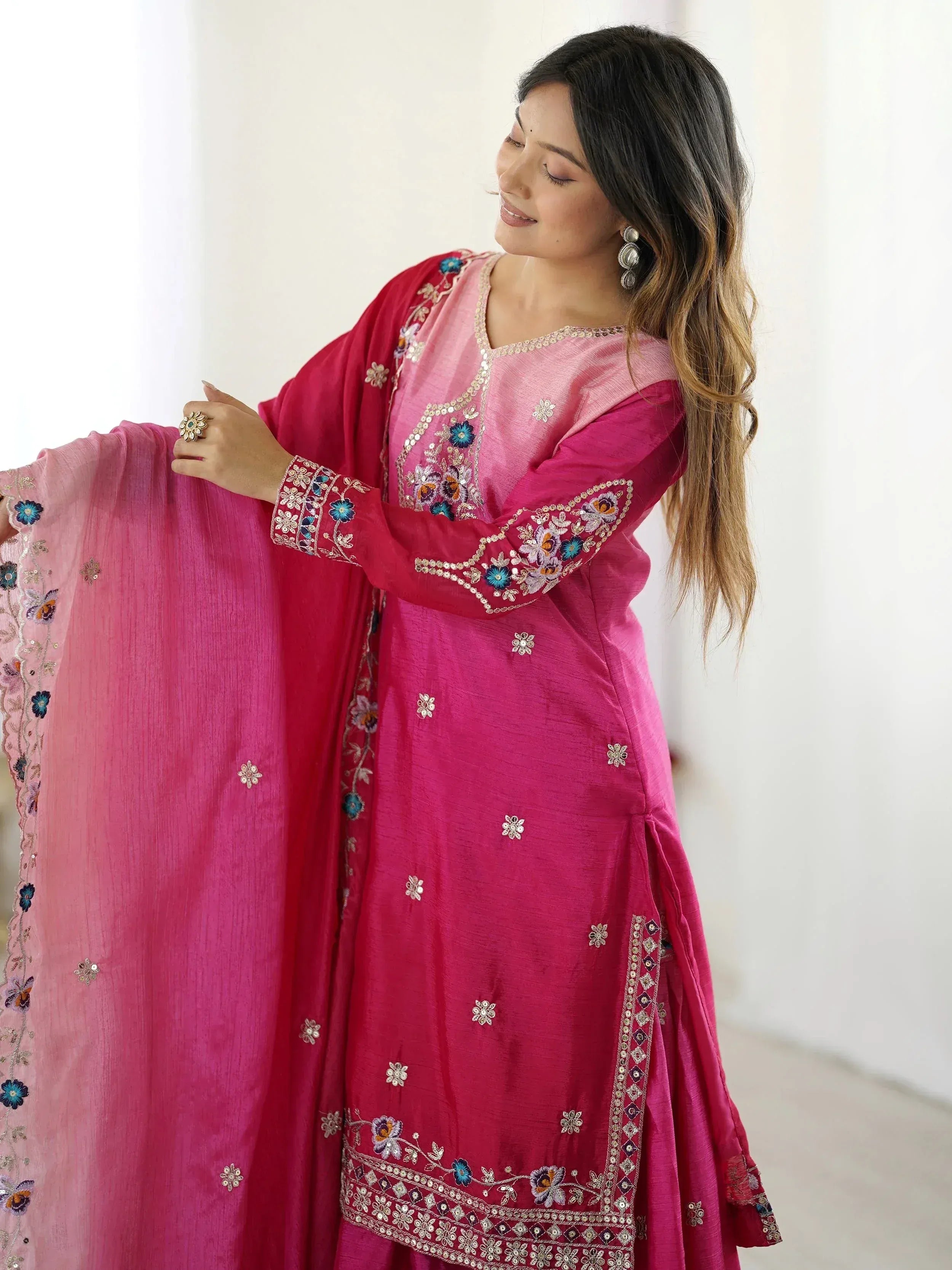 Pink embroidered Indian salwar kameez with floral detailing and matching dupatta, perfect for ethnic occasions