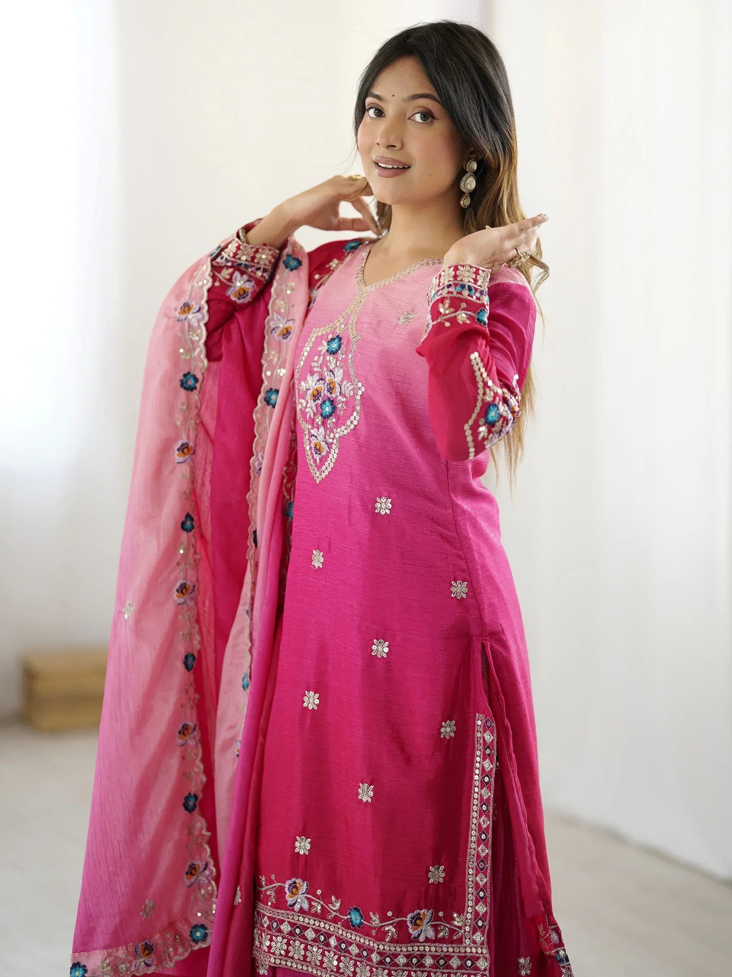 Pink embroidered Indian salwar kameez with floral detailing and matching dupatta, perfect for ethnic occasions
