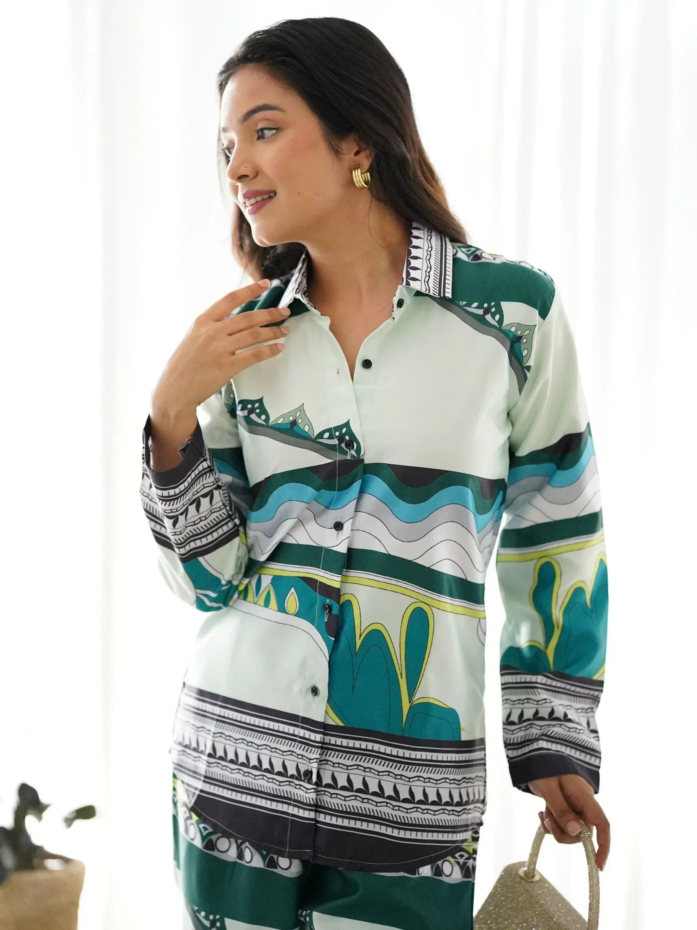 Woman in printed ethnic kurta with green and blue patterns, stylish salwar kameez outfit