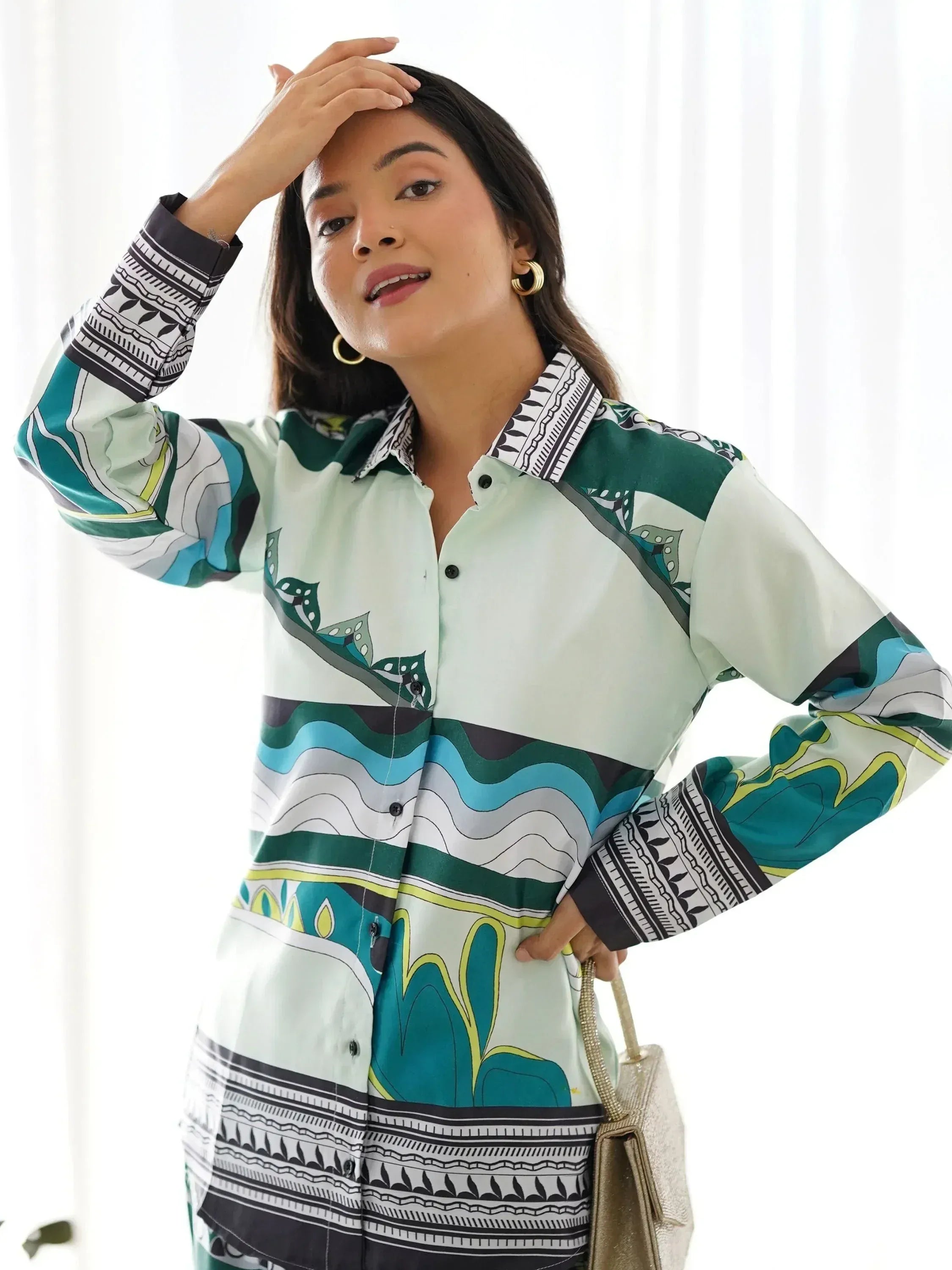 Woman in stylish printed ethnic shirt with green, blue, and white patterns, perfect for Indian wear