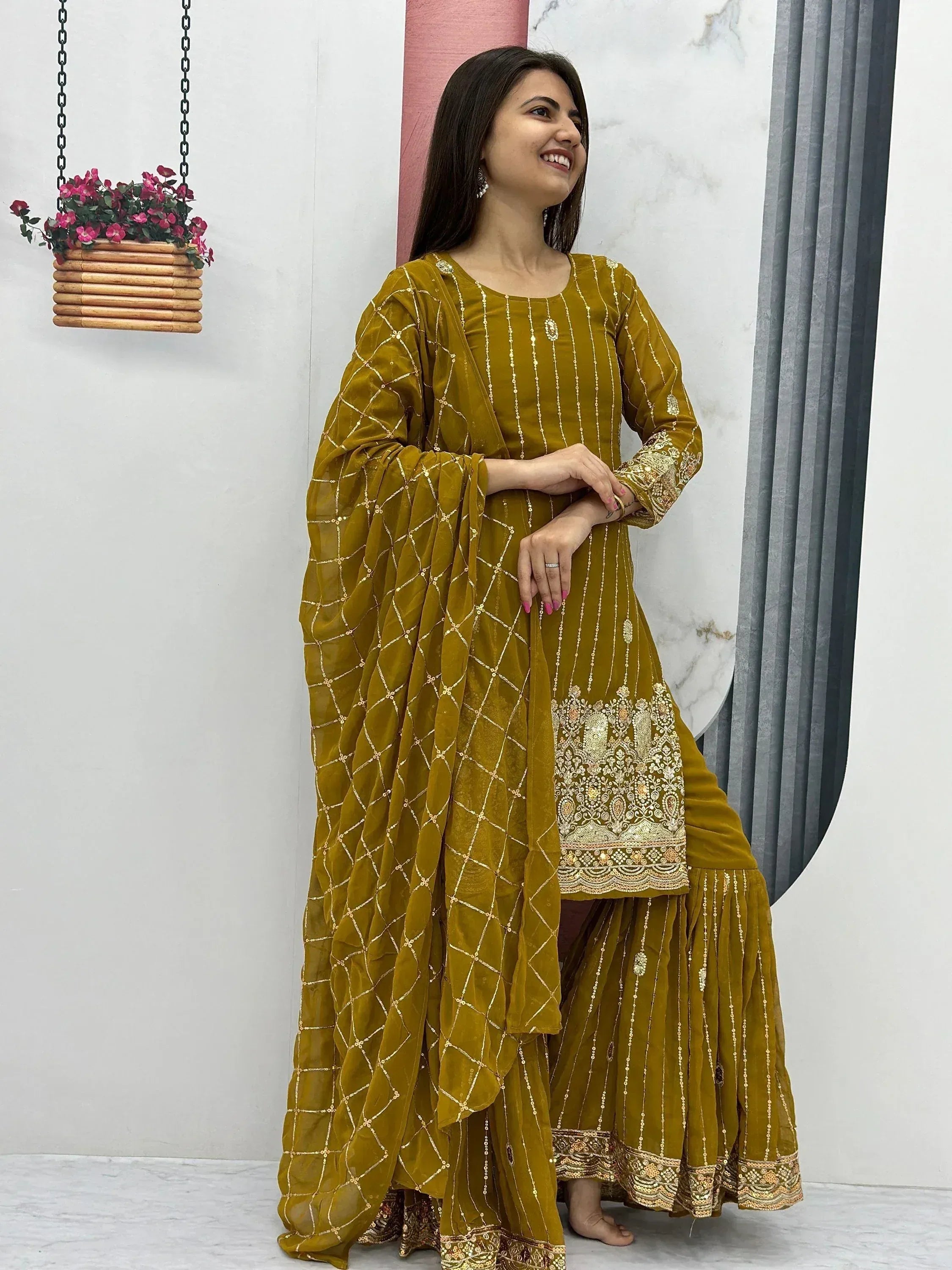 Mustard velvet salwar kameez with gold embroidery and matching dupatta, ideal for Indian ethnic occasions