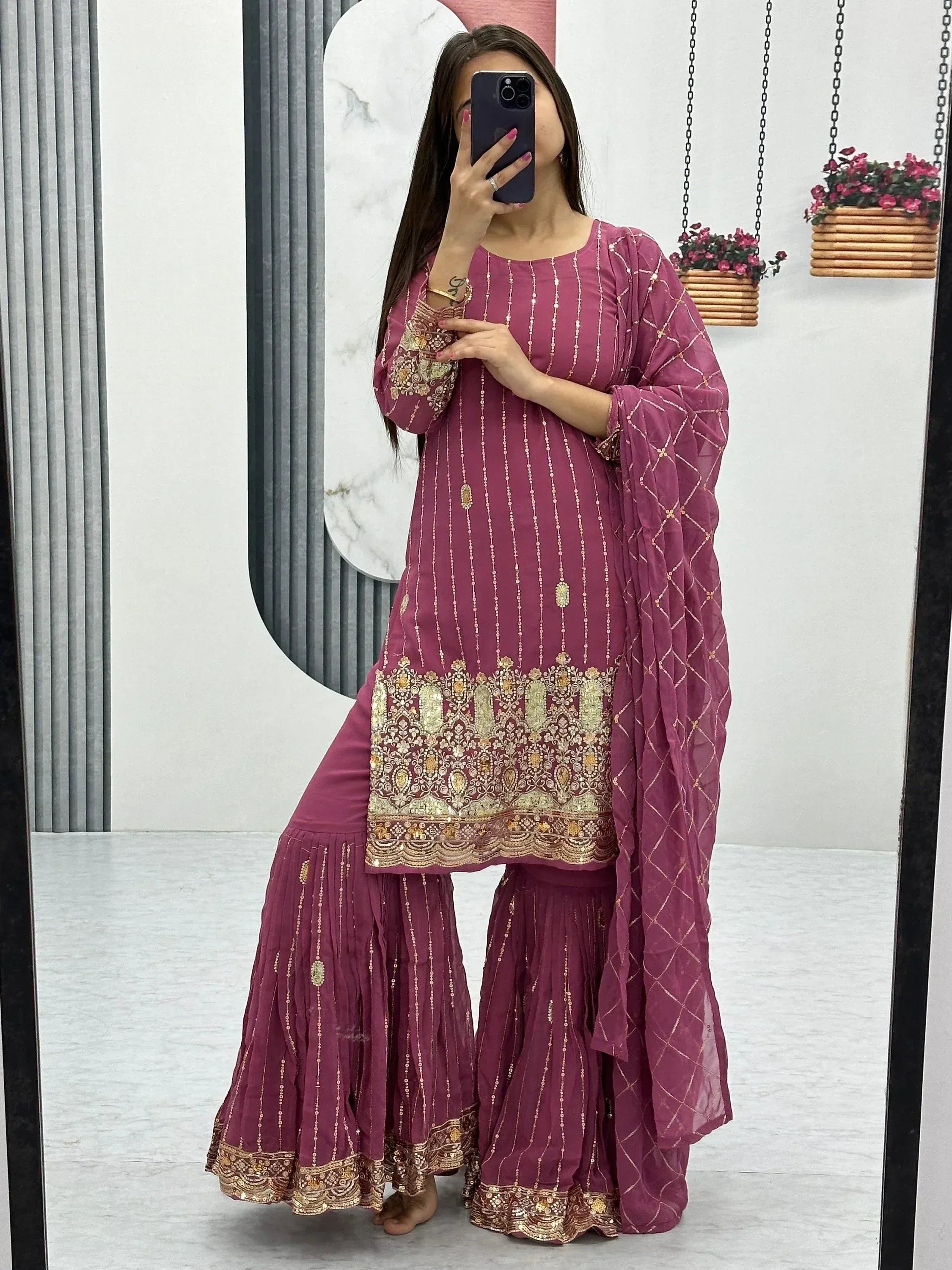Purple embroidered salwar kameez with gold detailing, mirror selfie in modern studio