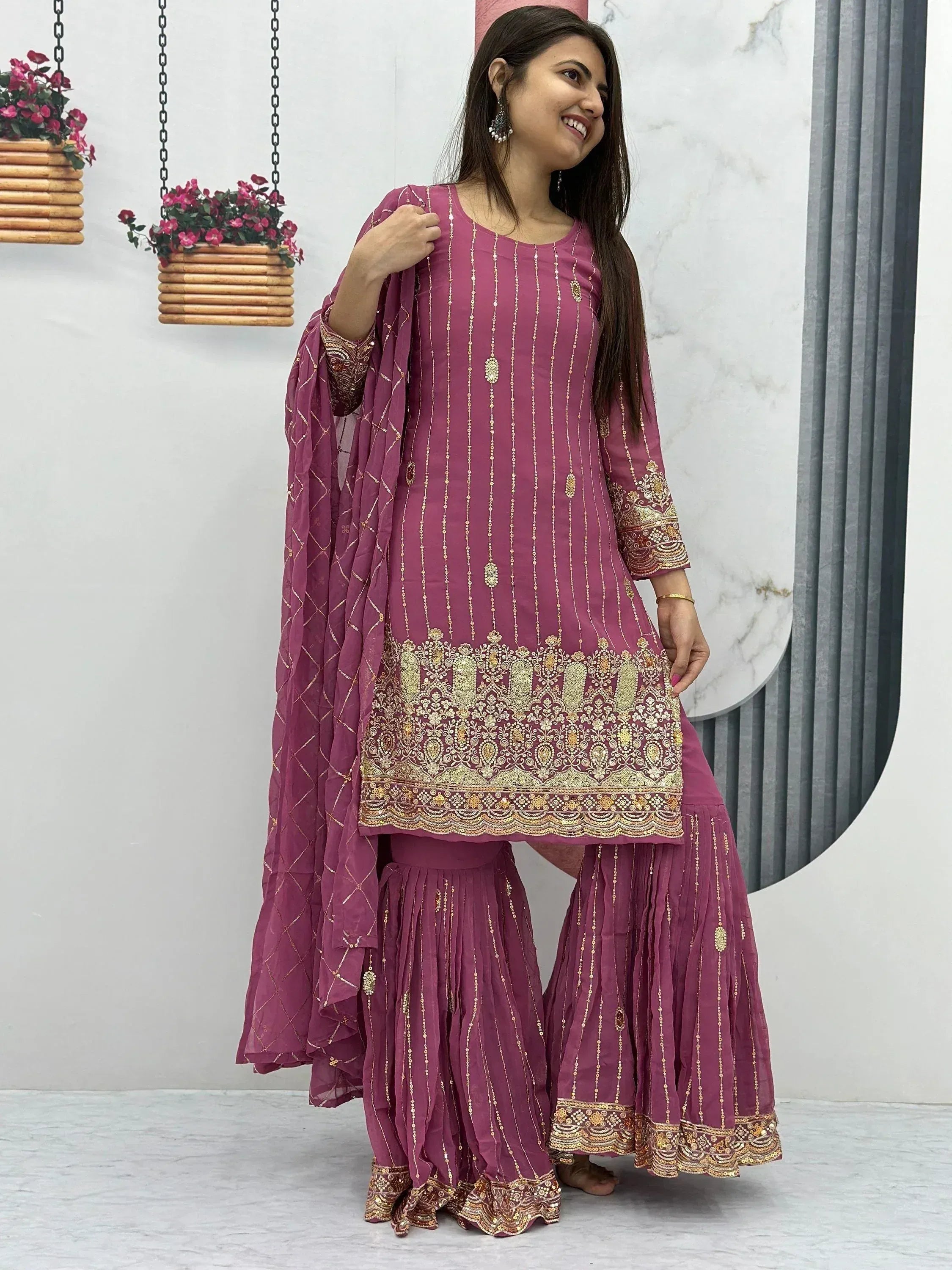 Purple Indian ethnic salwar kameez with gold embroidery and dupatta, perfect for festive occasions.