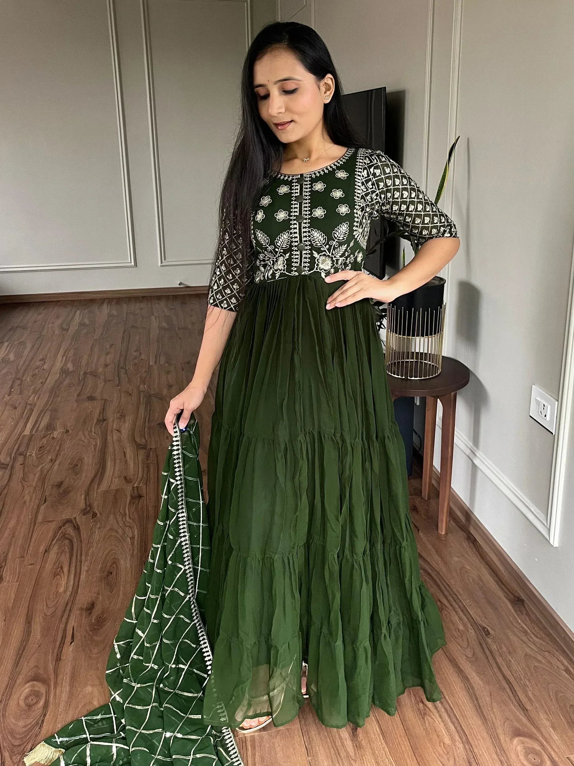 Green embroidered ethnic gown with matching dupatta, perfect for Indian occasions and festive wear.