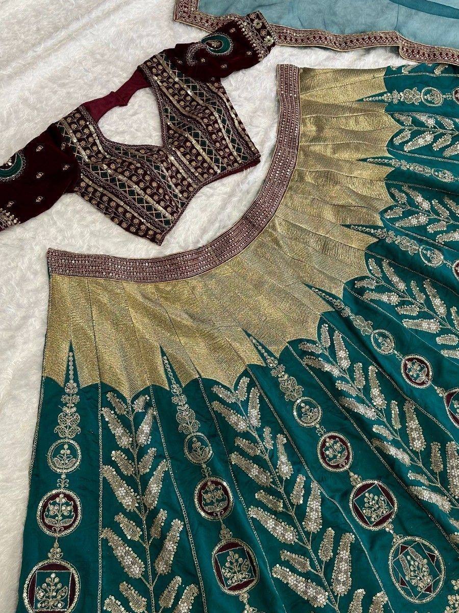 Teal and gold embroidered lehenga choli with maroon velvet blouse, perfect for Indian ethnic wear occasions