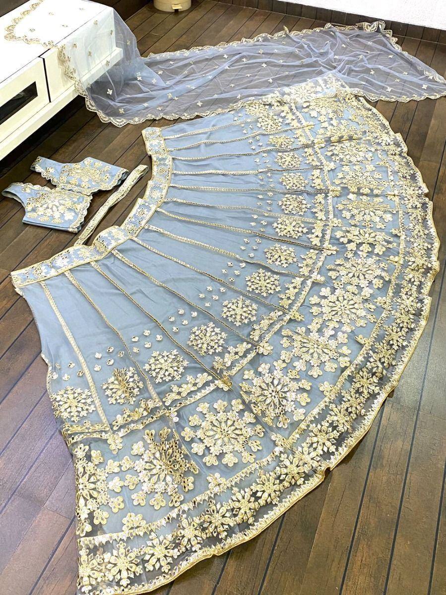 Light blue lehenga choli with gold floral embroidery and matching dupatta, ethnic Indian wear