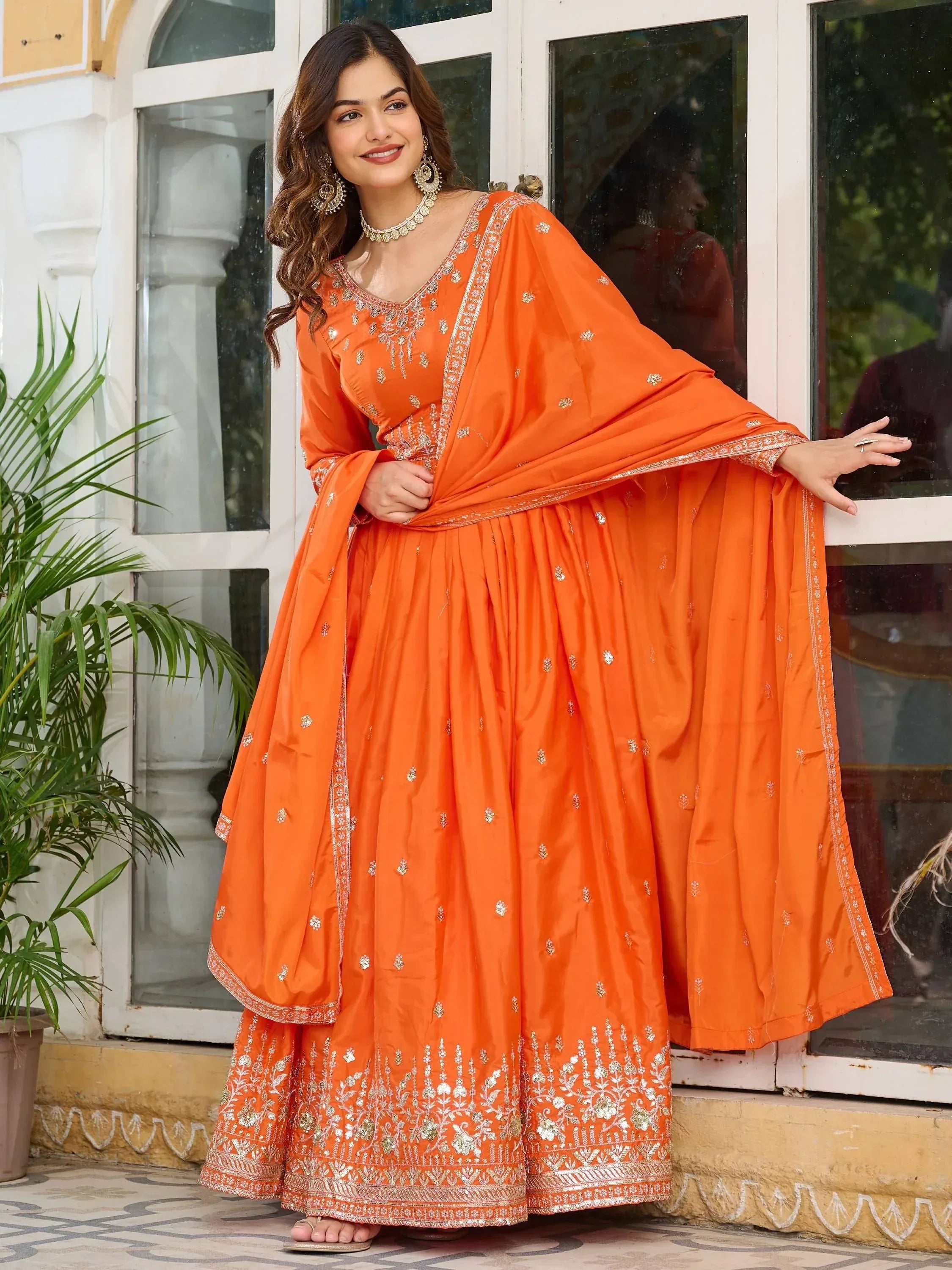 Orange embroidered anarkali suit with dupatta, perfect for Indian ethnic occasions and festive wear.