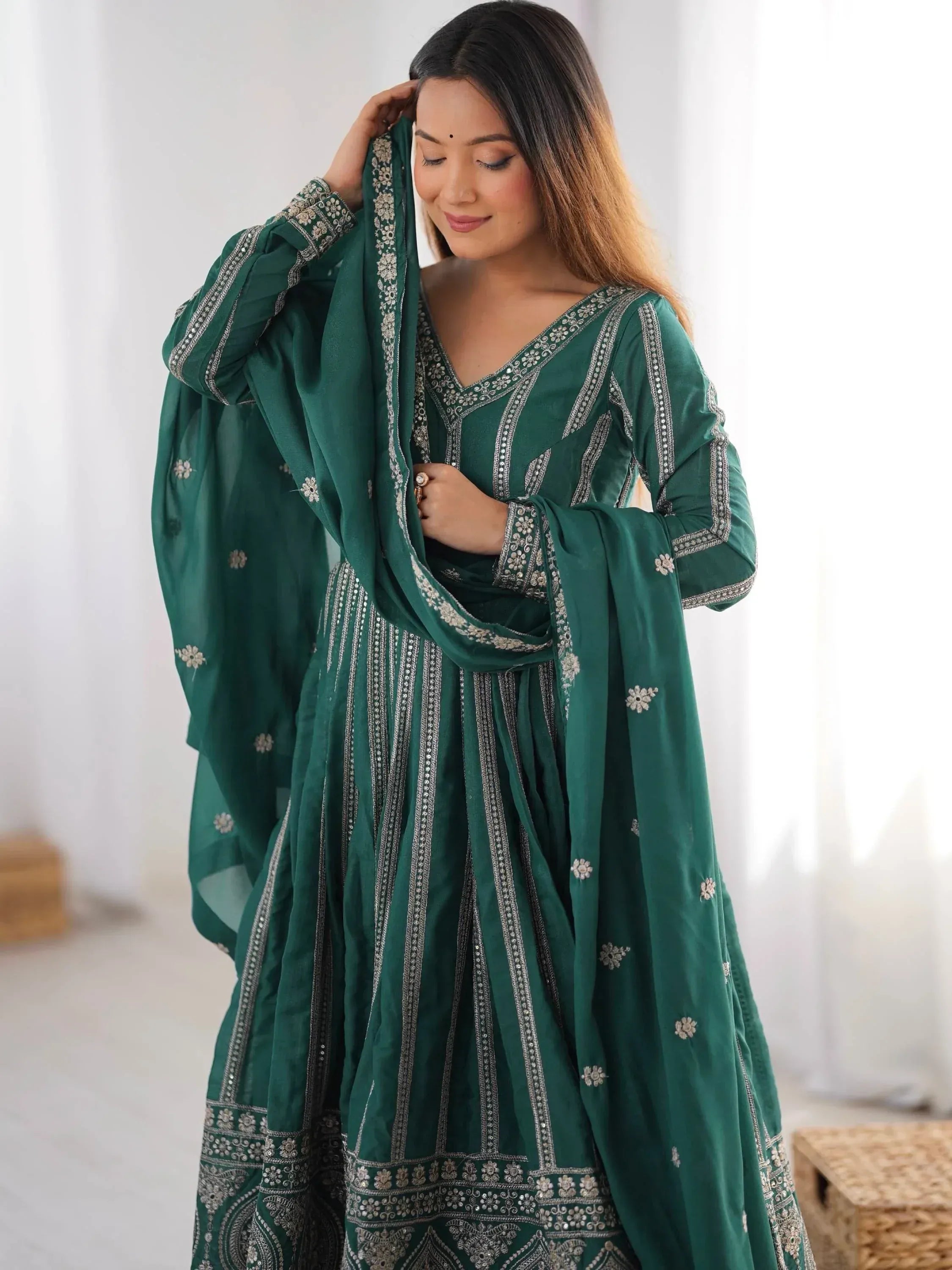 Emerald green embroidered salwar kameez with silver detailing, perfect for Indian ethnic wear occasions