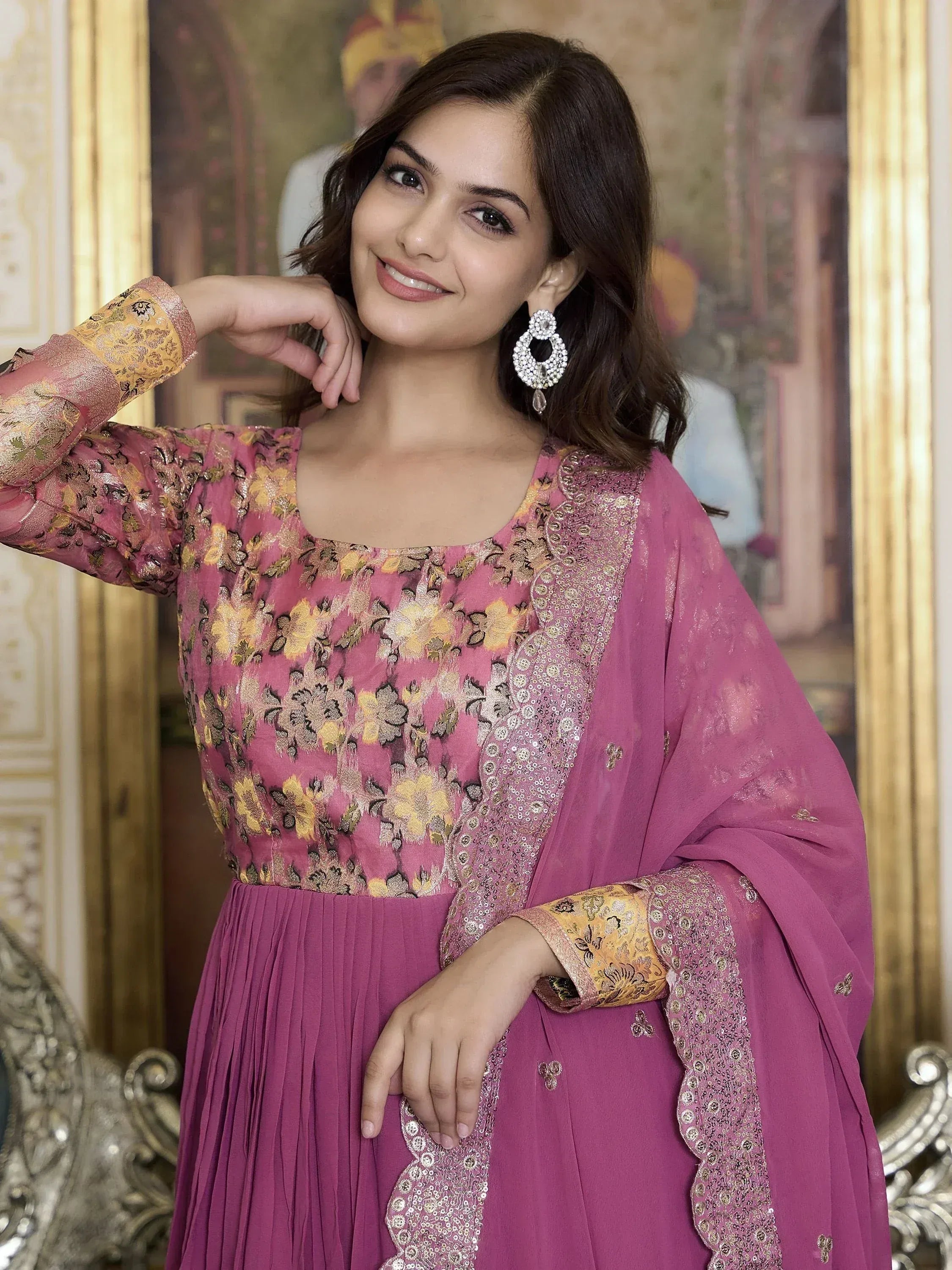 Pink floral embroidered ethnic gown with gold detailing and matching dupatta, perfect for Indian occasions