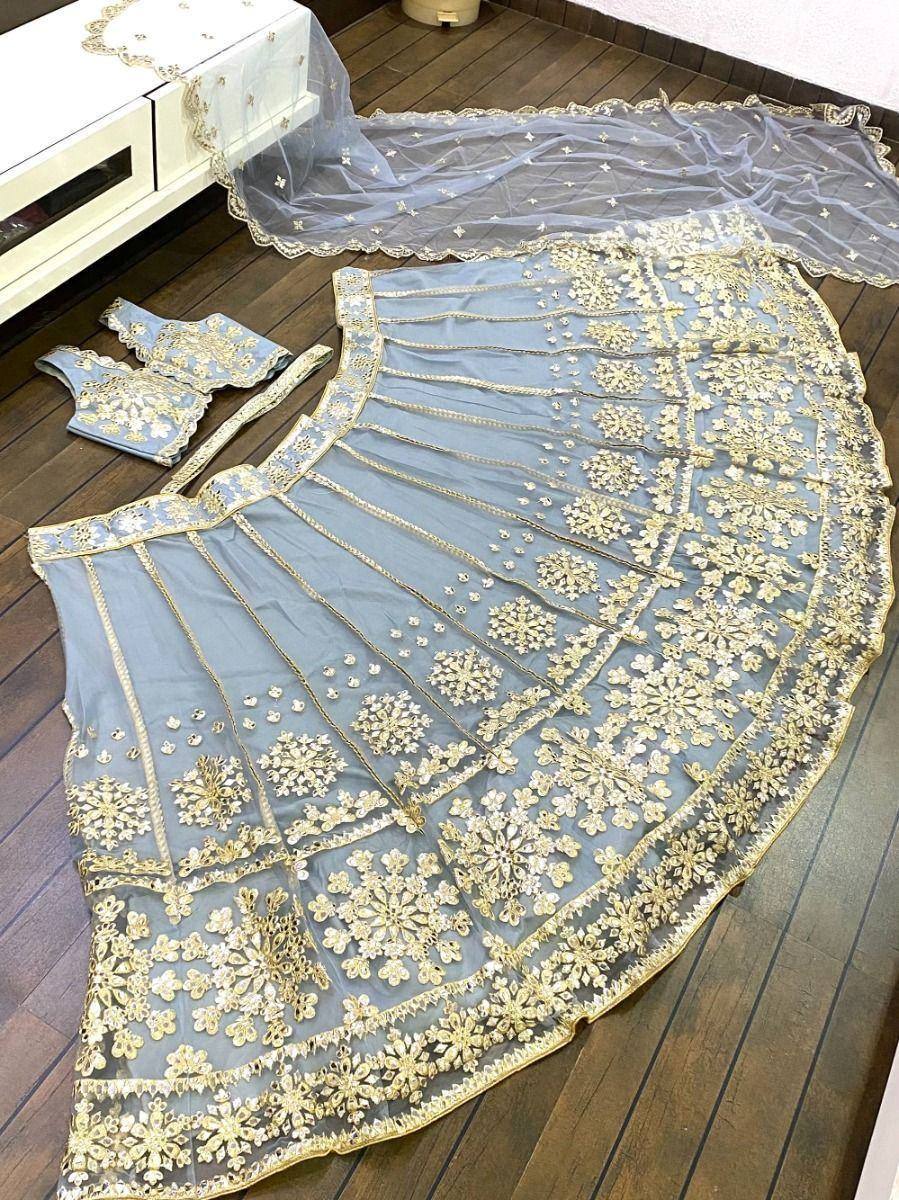 Light blue lehenga choli with gold floral embroidery, sheer dupatta, ethnic Indian wear
