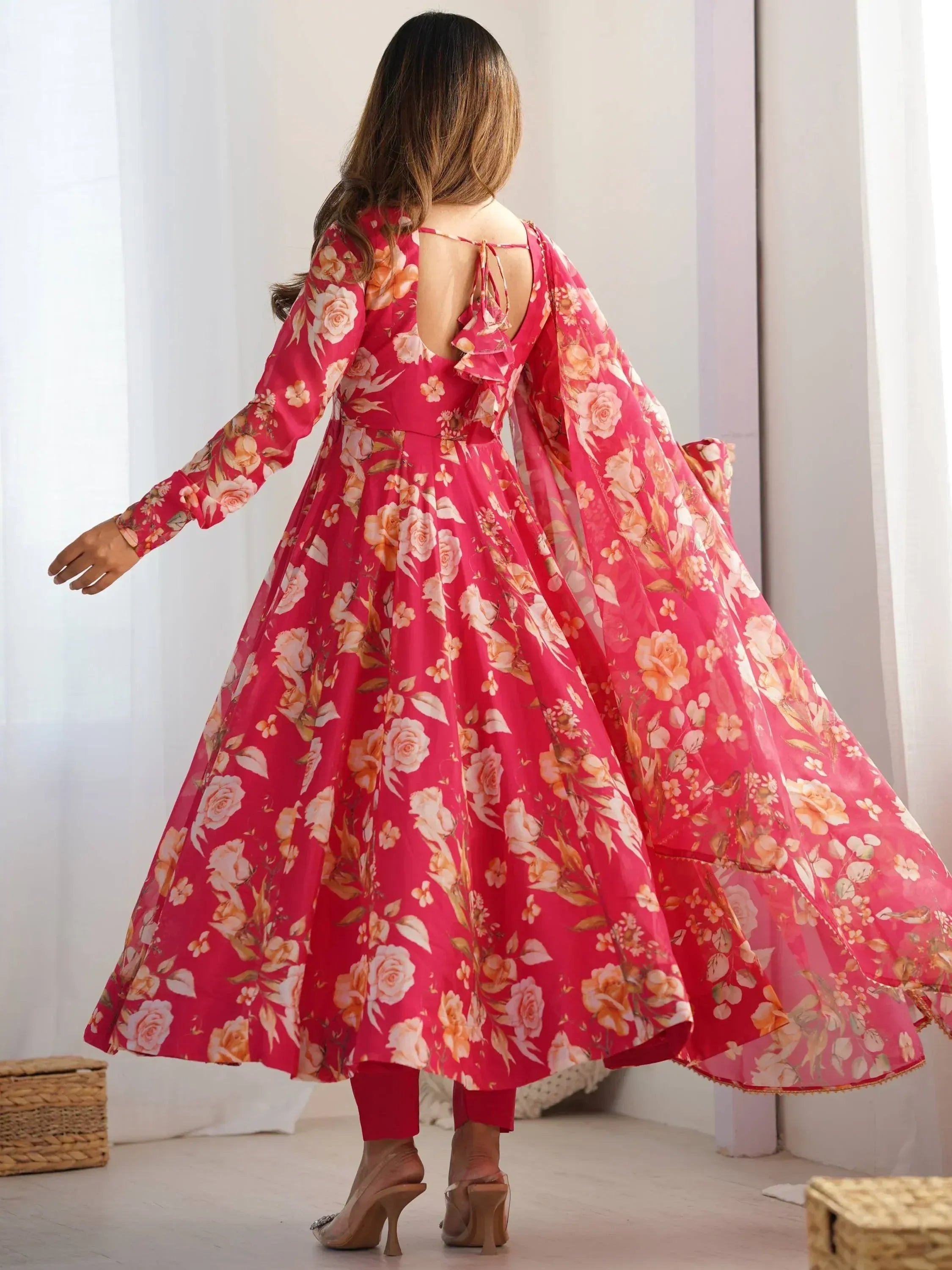 Pink floral ethnic gown with back tie detail, flared sleeves, and flowing skirt for women