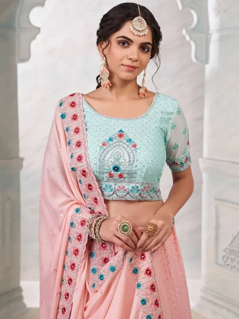 Fascinating Peach Sequined Work Georgette Party Wear Lehenga Choli