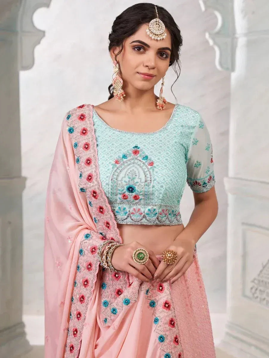 Mint and pink embroidered lehenga choli with floral detailing, perfect for Indian ethnic occasions