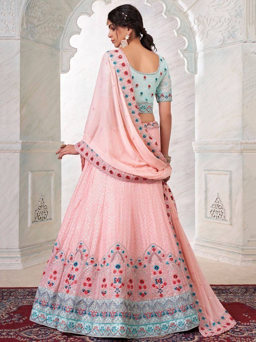 Pink and mint designer lehenga choli with floral embroidery, perfect for Indian weddings and festive occasions.